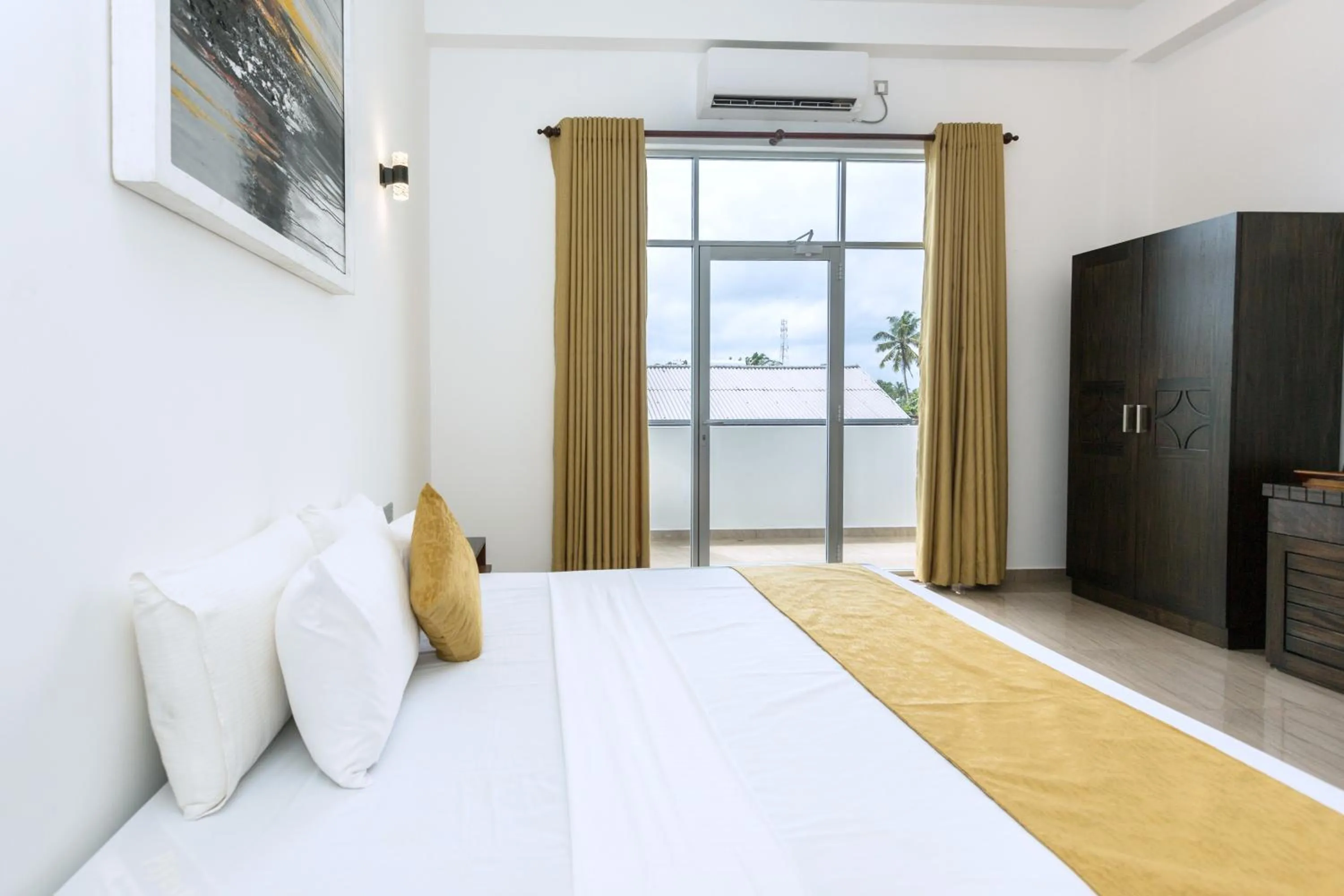 Bed in Polhena Grand Resort & Banquet