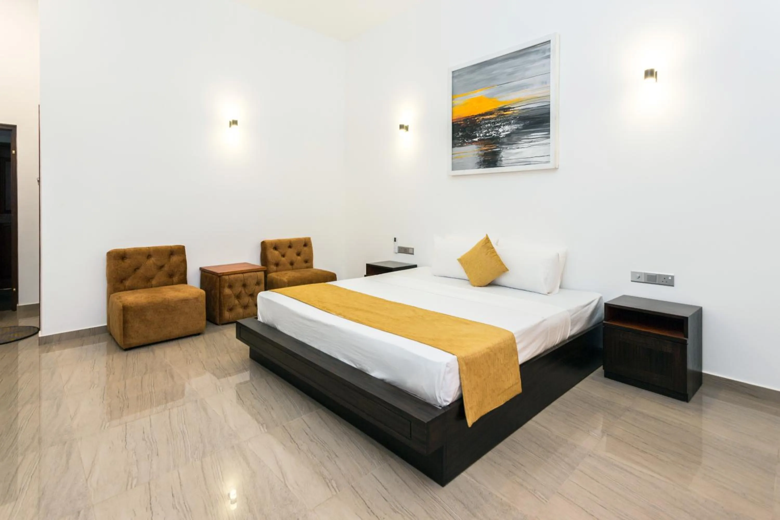 Bed in Polhena Grand Resort & Banquet