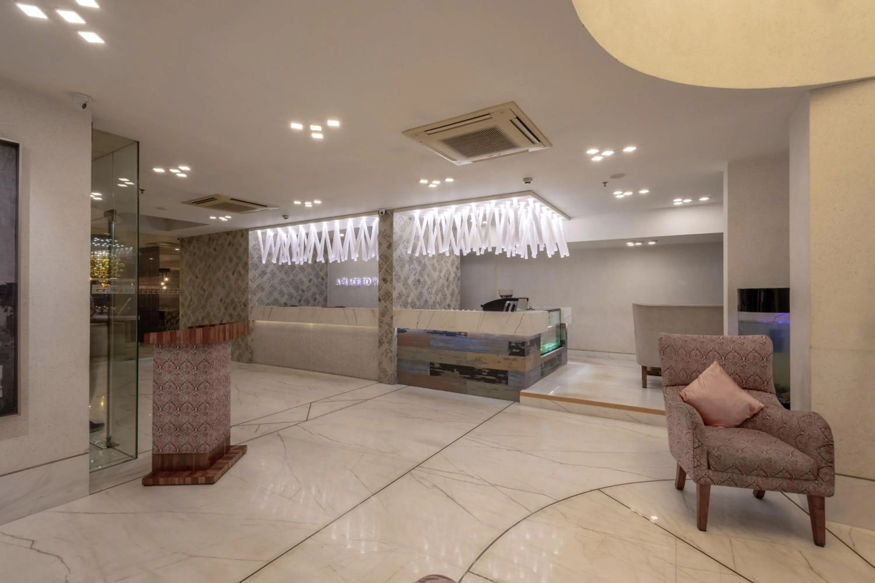 Seating area in De Glance Hotel, Near Surat Railway Station