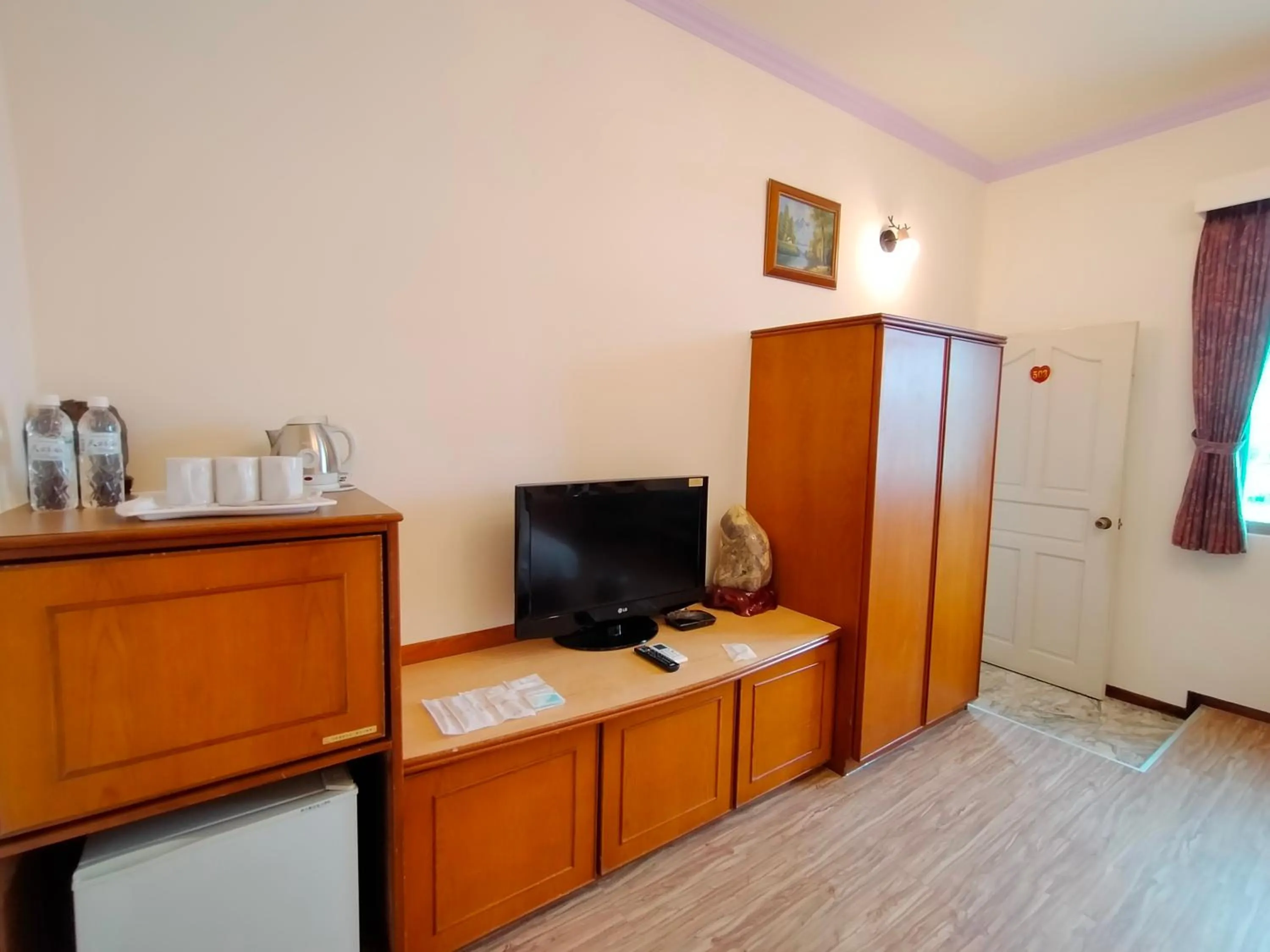 Decorative detail, TV/Entertainment Center in Tau Tau Chu Hotel