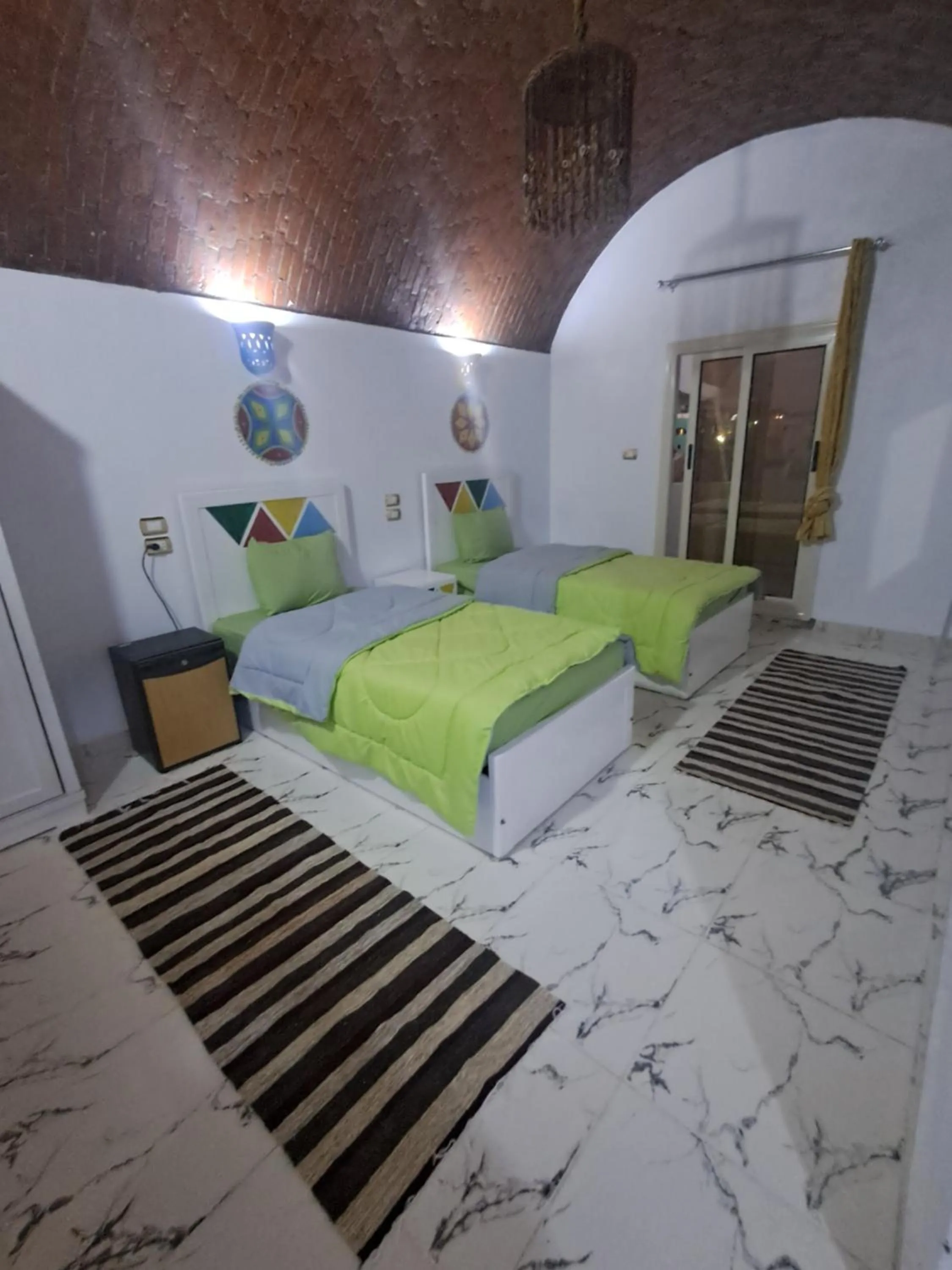 Bed in Lawanda Nubian B&B