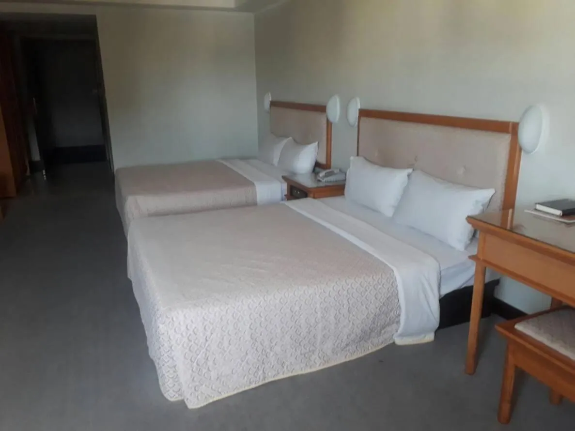 Bed in Kenting City Gate Hotel