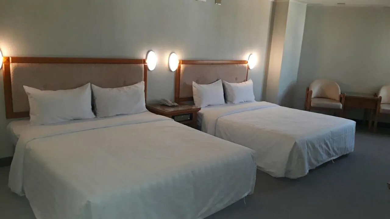Bed in Kenting City Gate Hotel