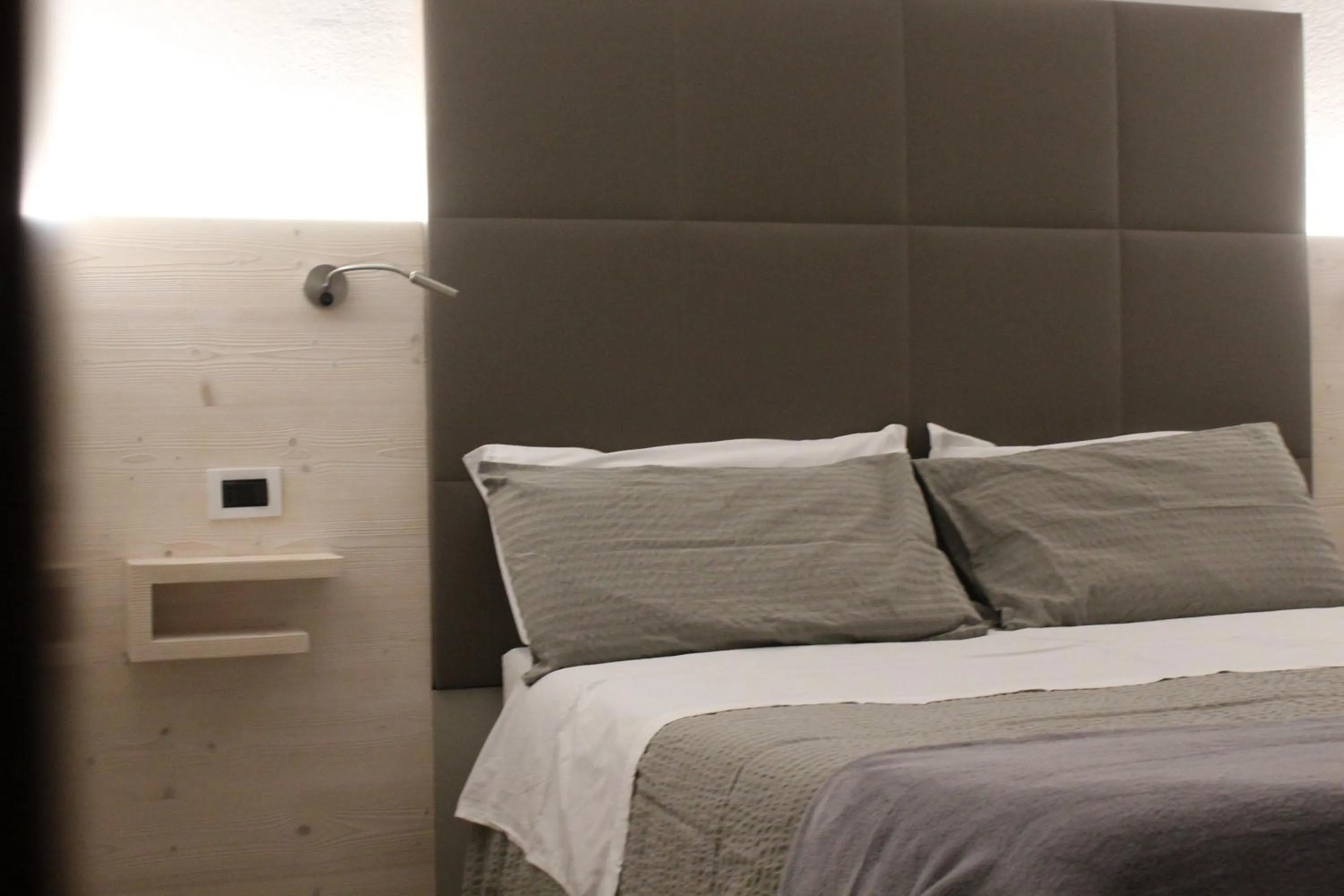 Bed in Hotel Dolomiti