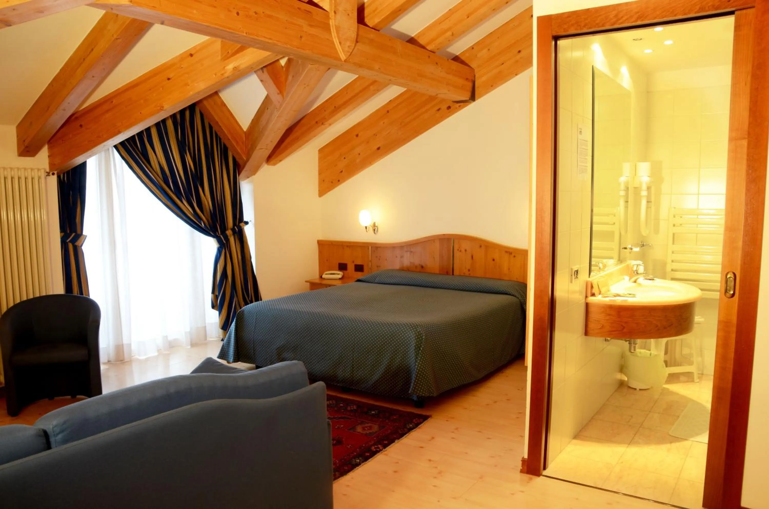 Bed in Hotel Dolomiti