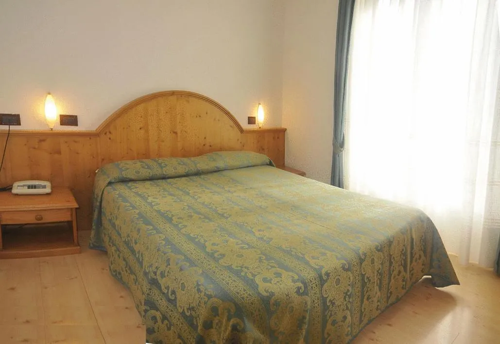 Bed in Hotel Dolomiti