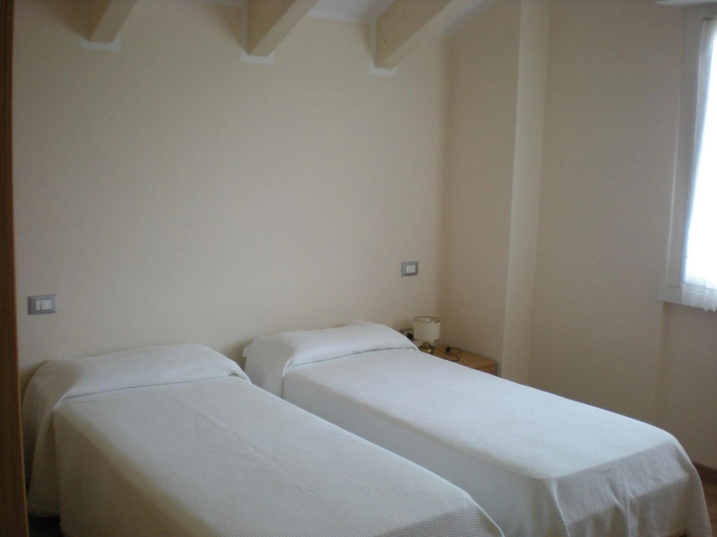 Bed in Hotel Dolomiti