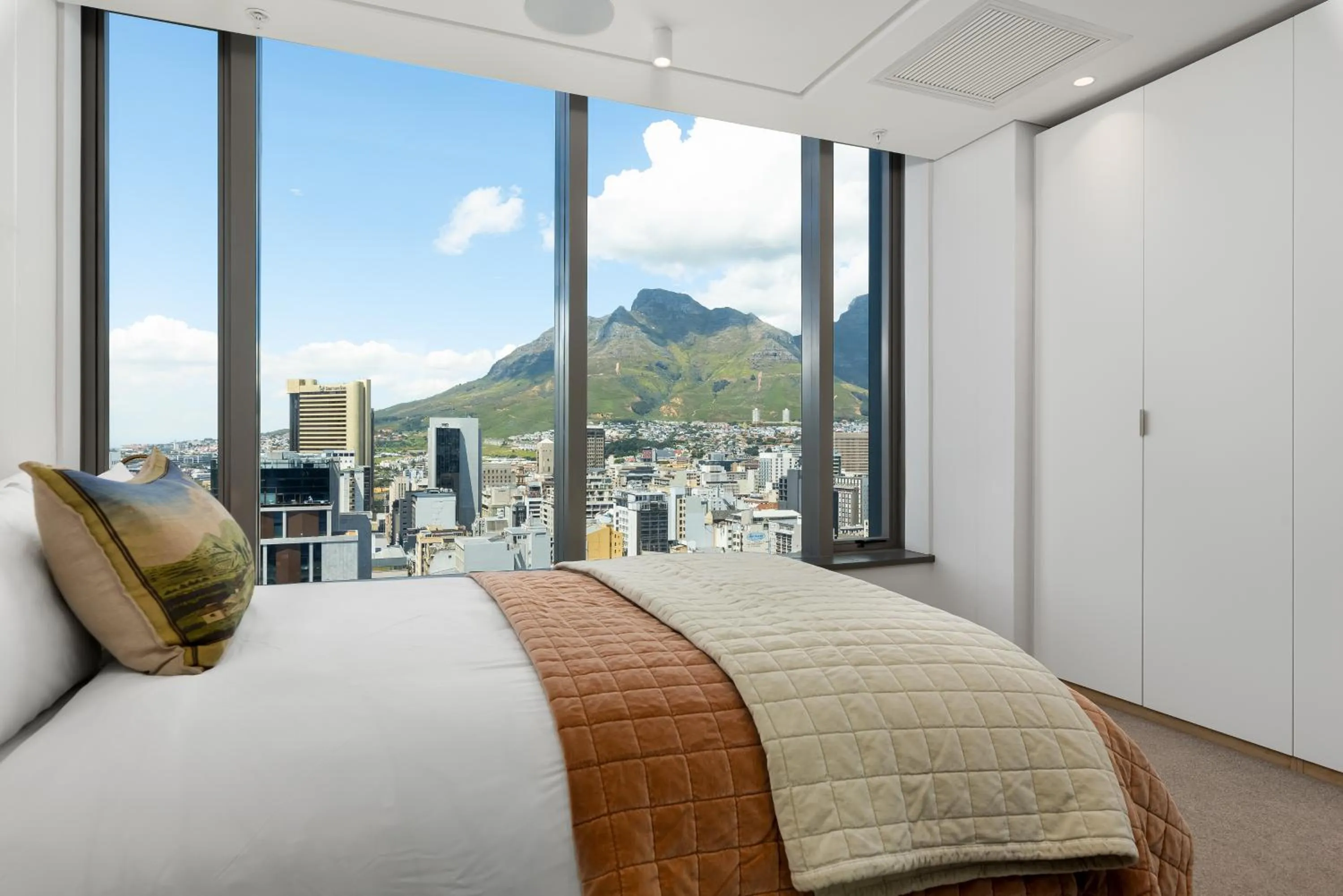 Bed in 117 on Strand Luxury Apartments