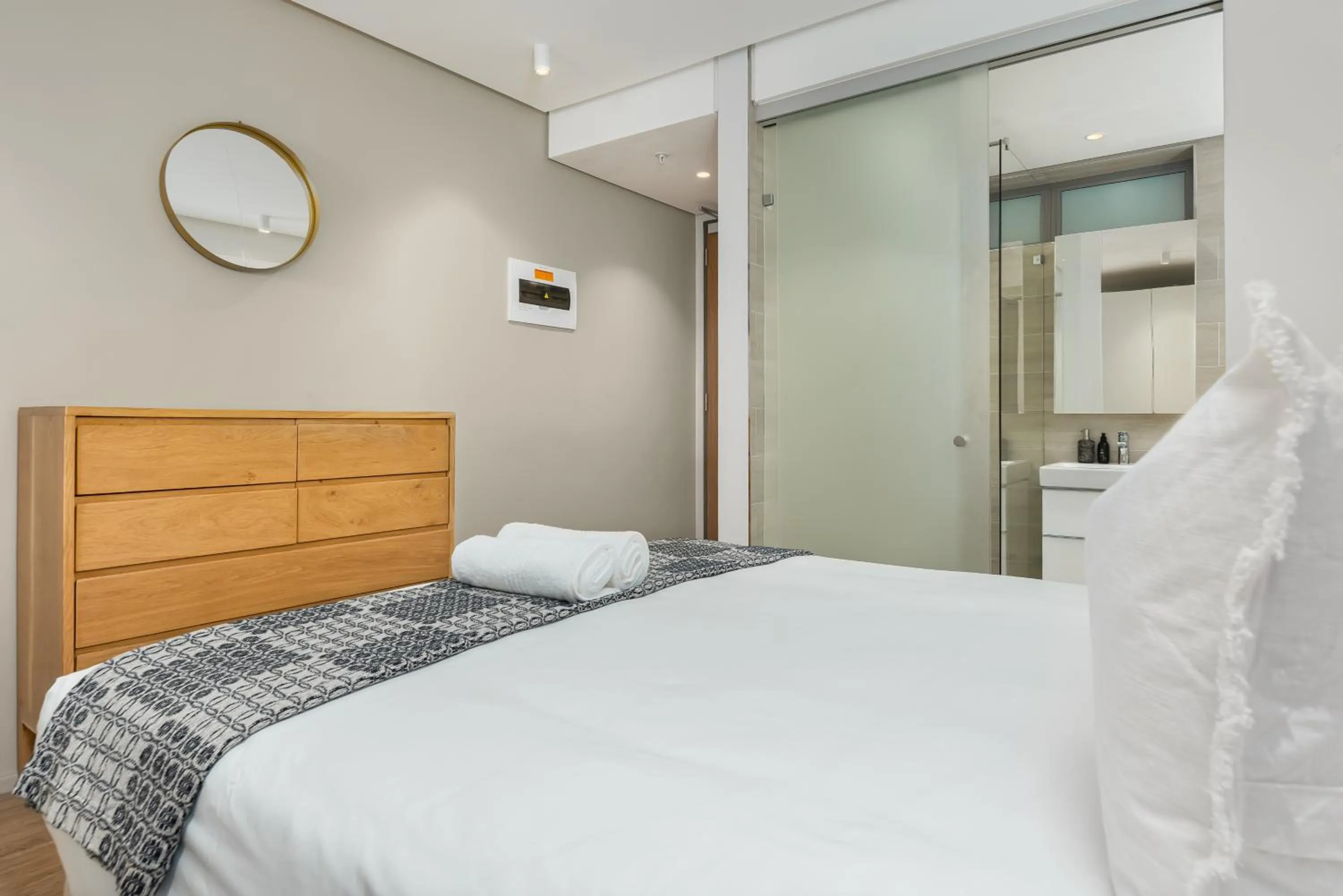 Bed in 117 on Strand Luxury Apartments