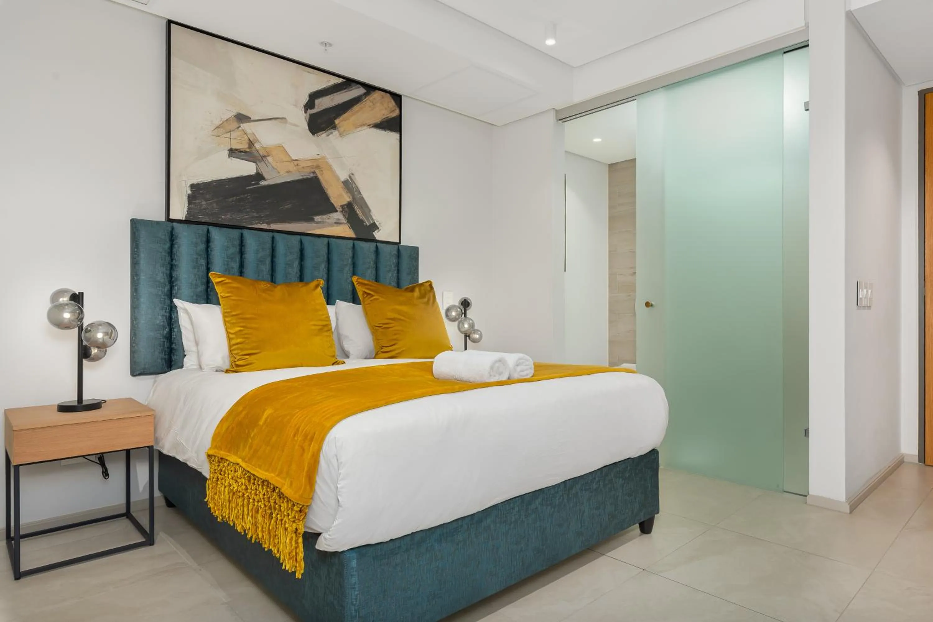 Bed in 117 on Strand Luxury Apartments