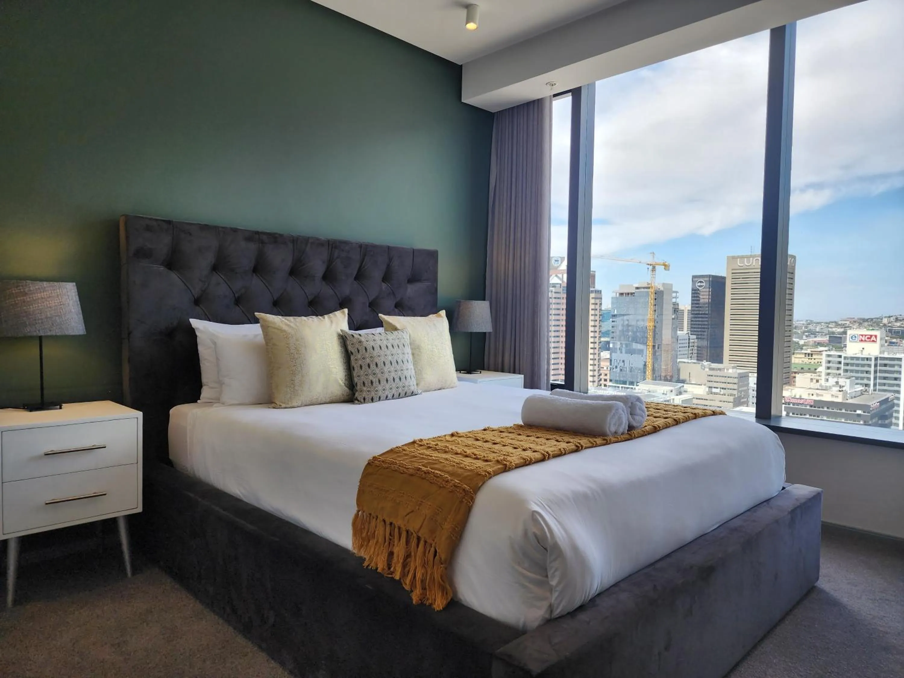 Bed in 117 on Strand Luxury Apartments