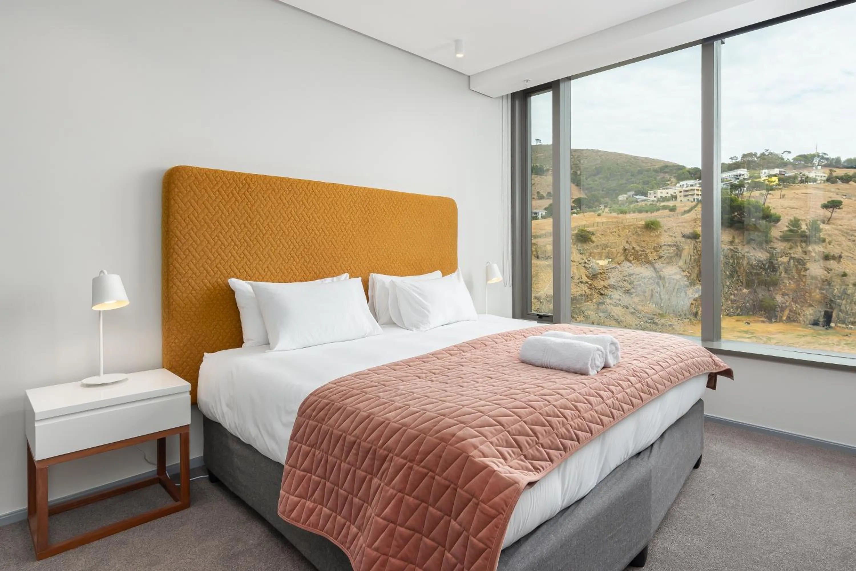 Bed in 117 on Strand Luxury Apartments