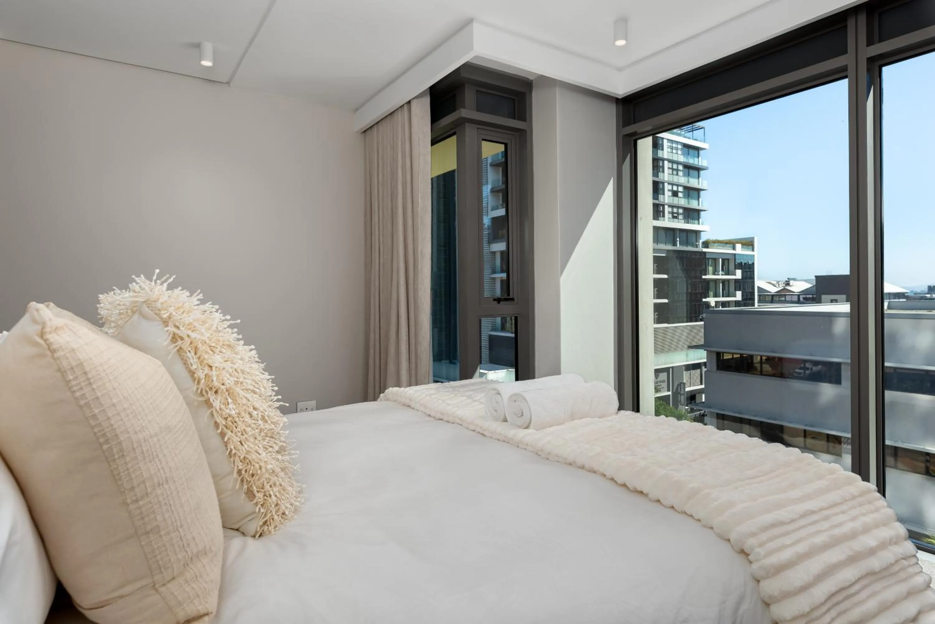 Bed in 117 on Strand Luxury Apartments