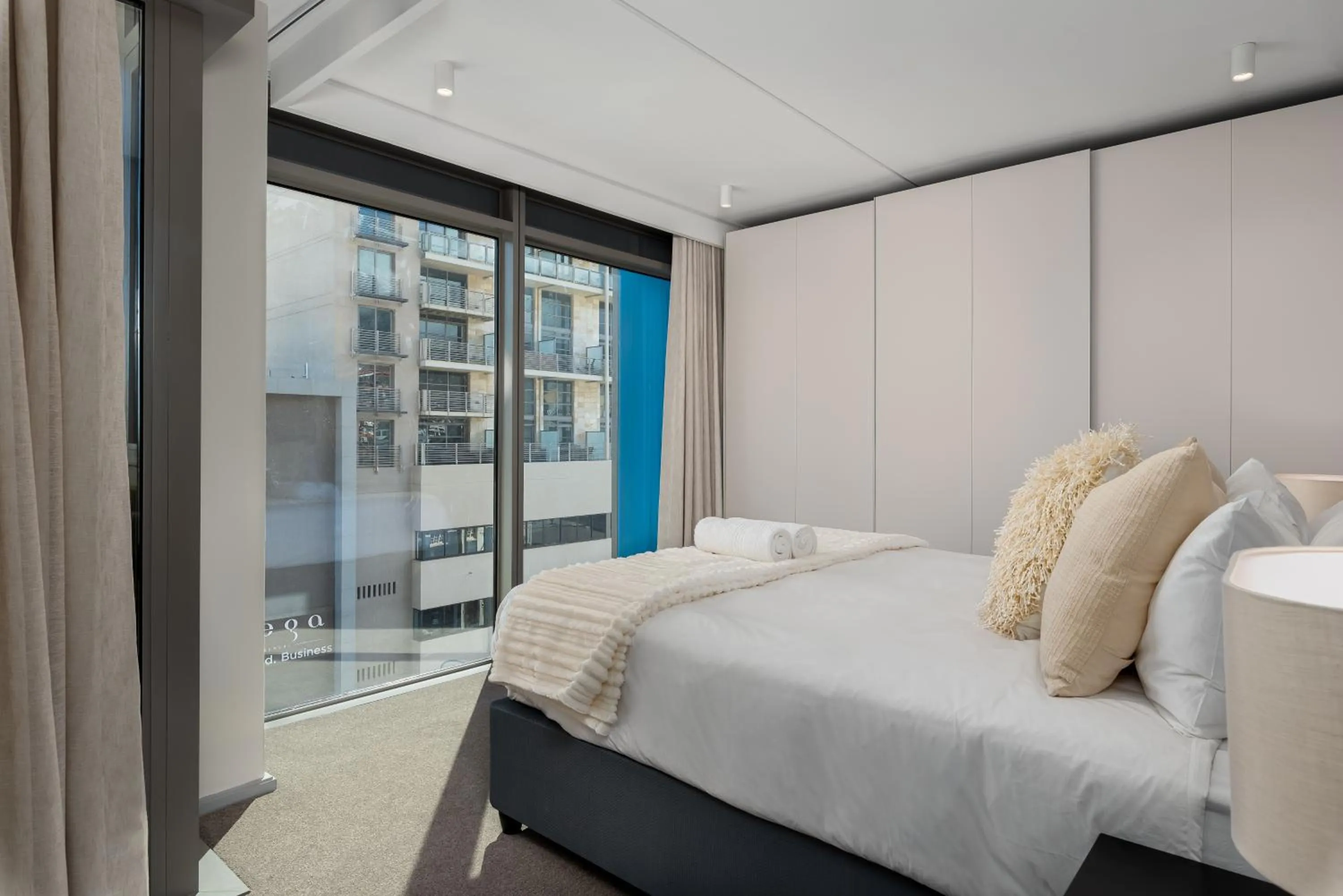 Bed in 117 on Strand Luxury Apartments