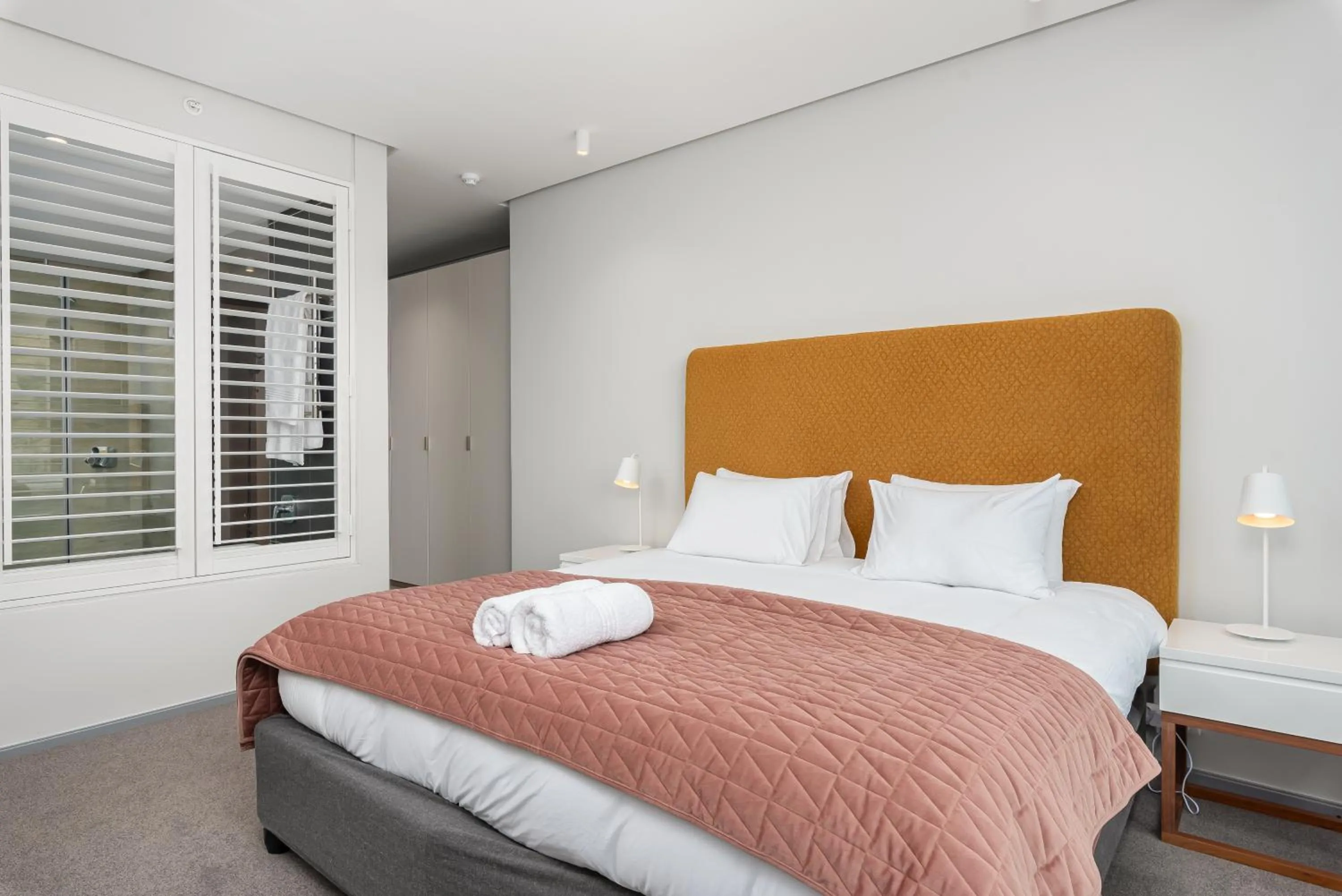 Bed in 117 on Strand Luxury Apartments
