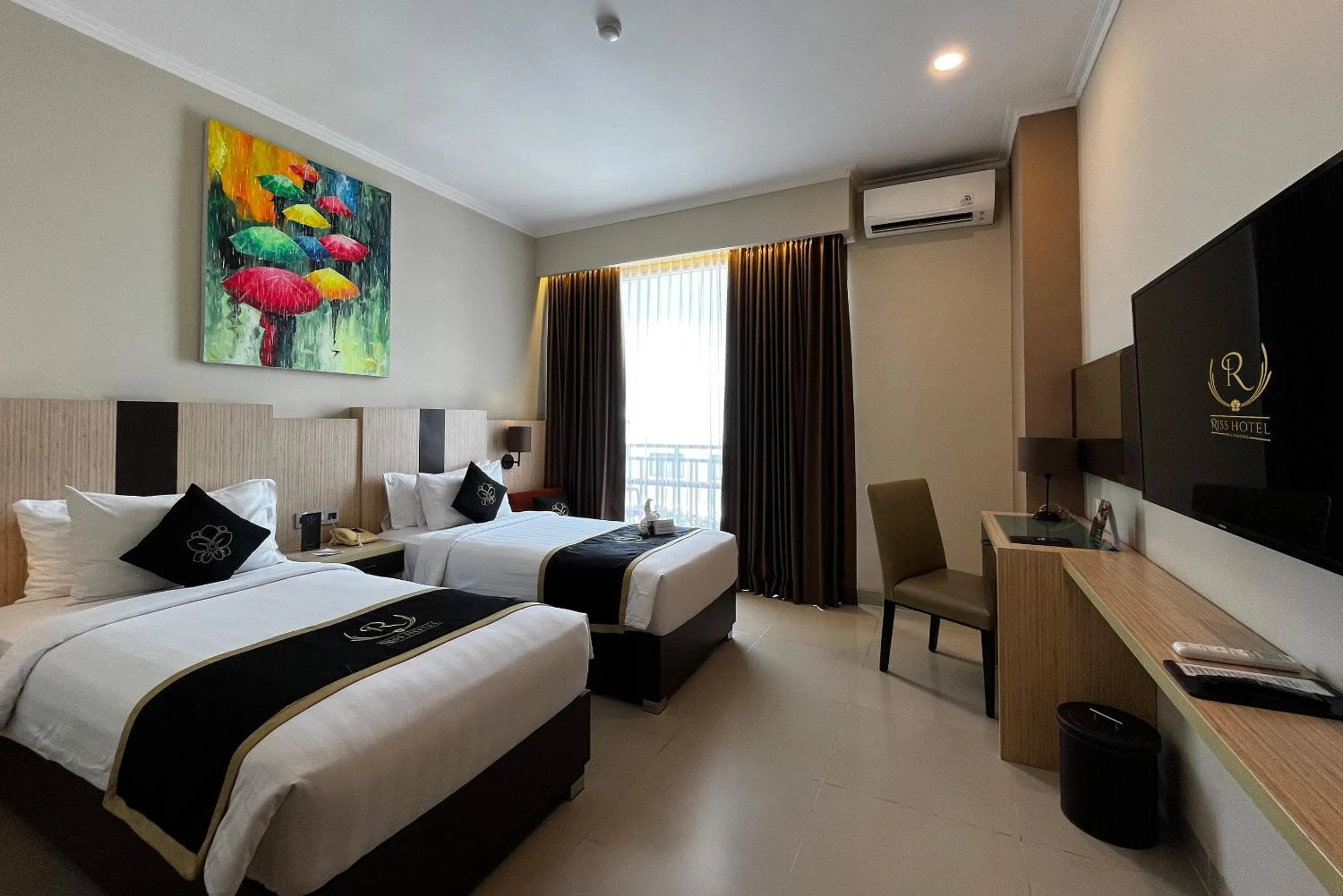 Bed in Riss Hotel Malioboro