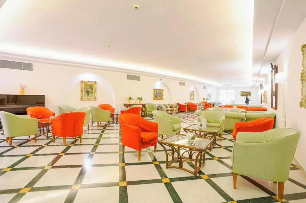 Communal lounge/ TV room in Hotel Villa Maria