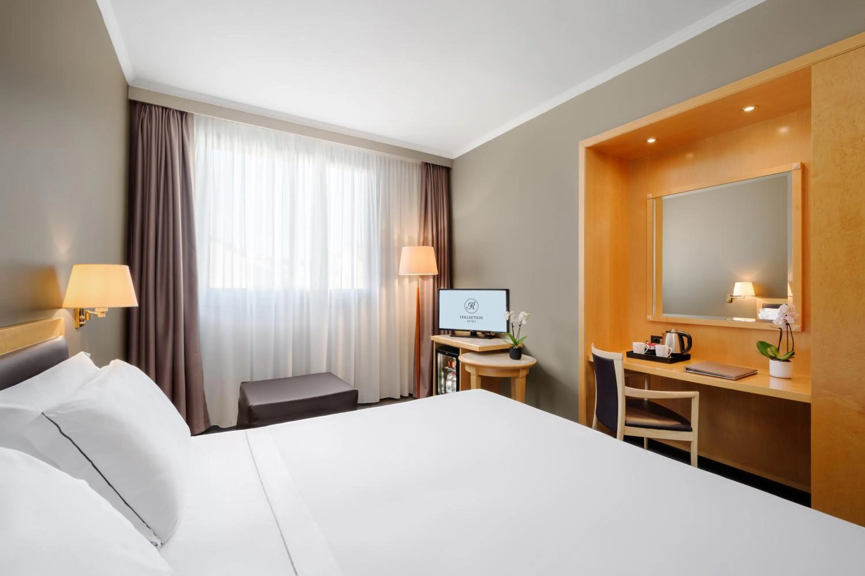 Photo of the whole room, Bed in City Life Hotel Poliziano, by R Collection Hotels