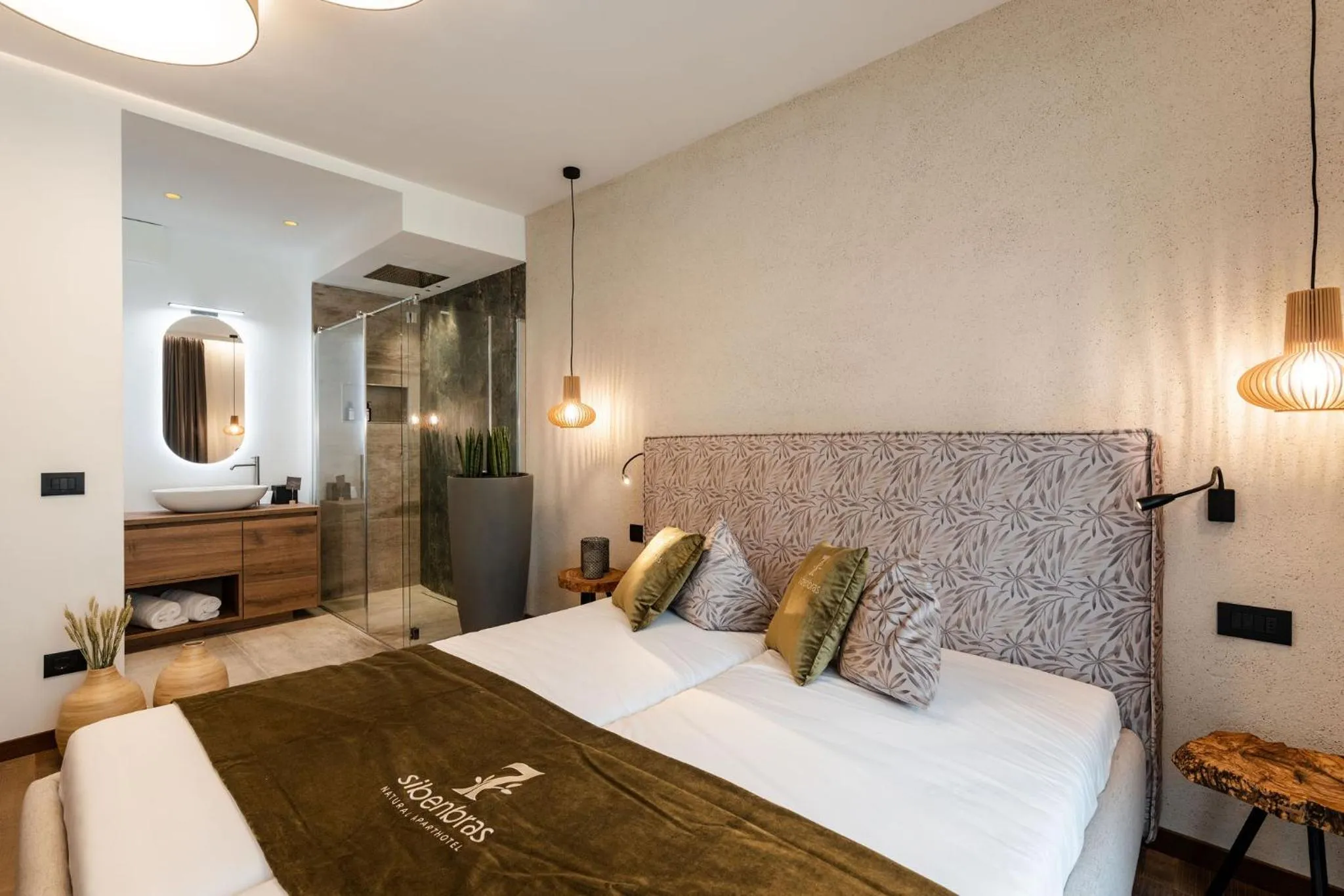 Bed in Sibenbras Natural Aparthotel