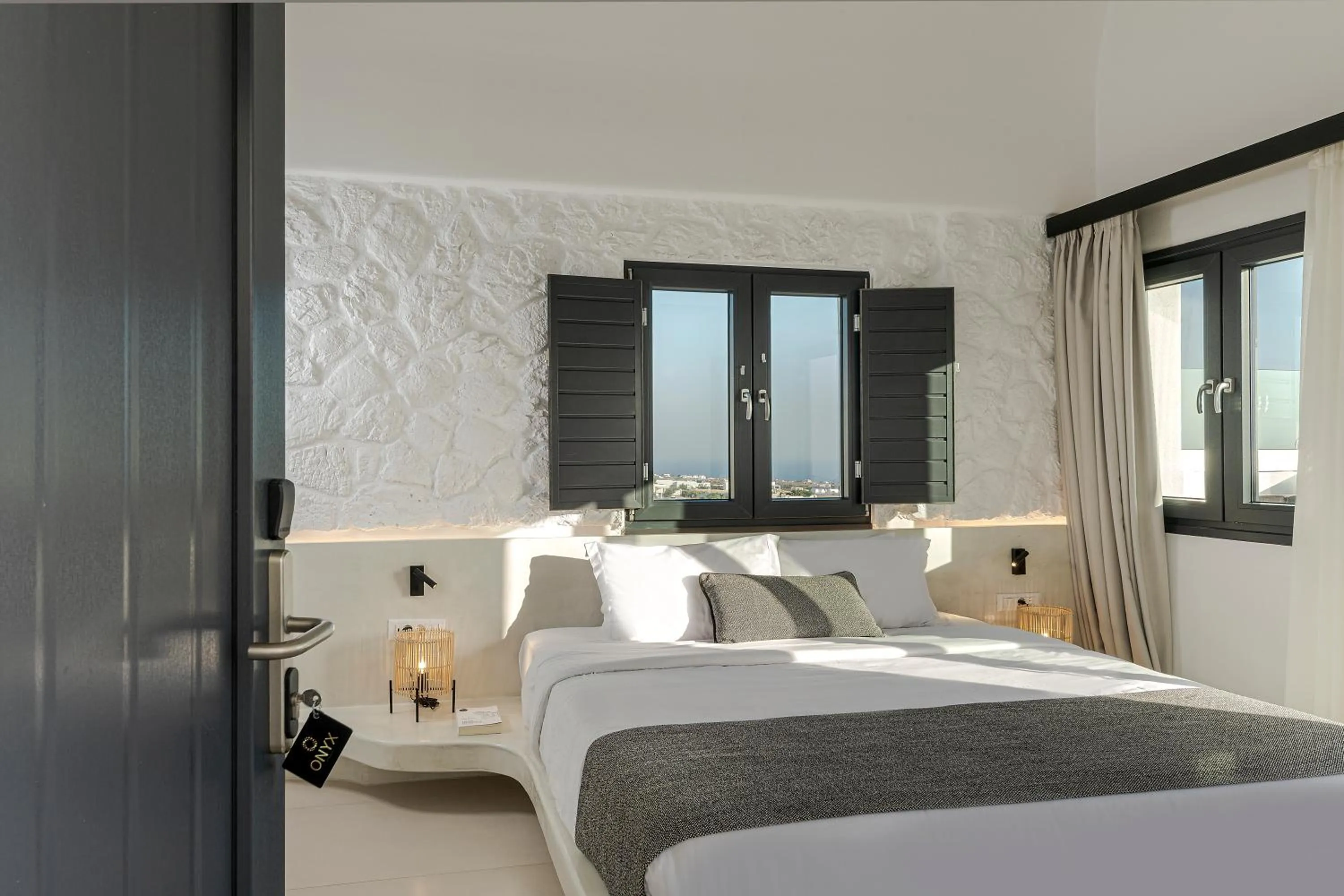 Bed in Onyx Hotel & Suites