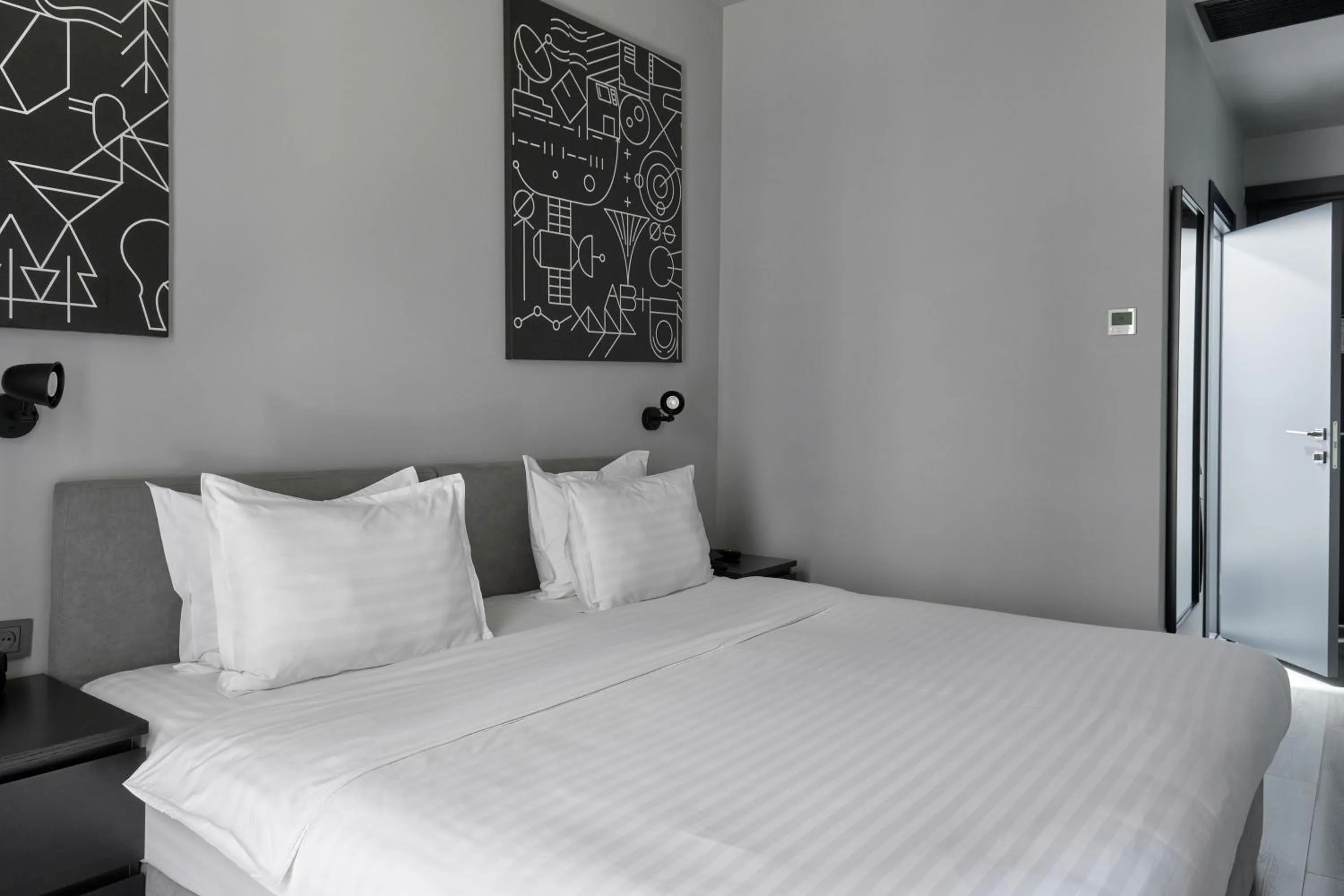 Bed in Sapiens Hotel