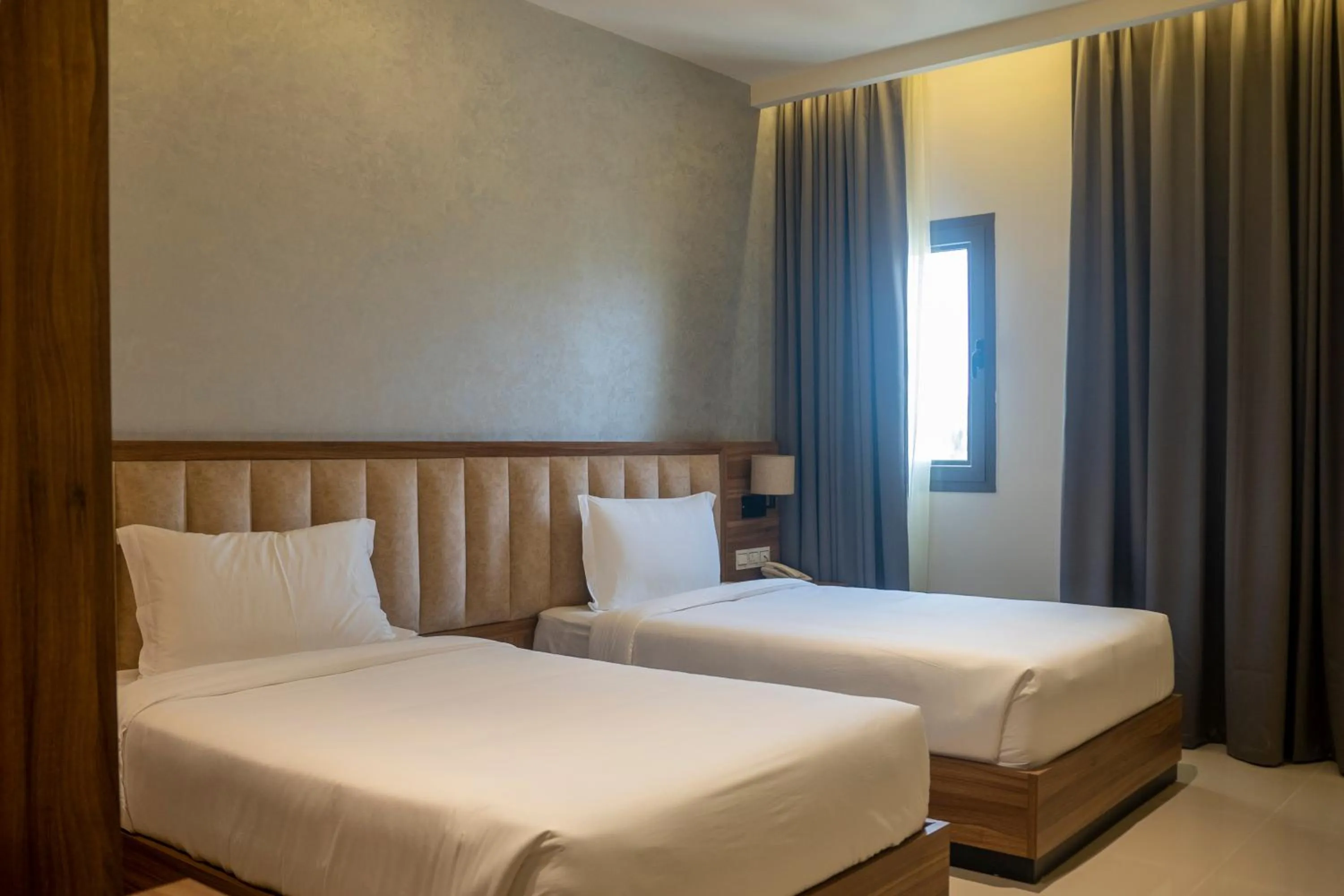 Bed in The Plaza Hotel & Resort