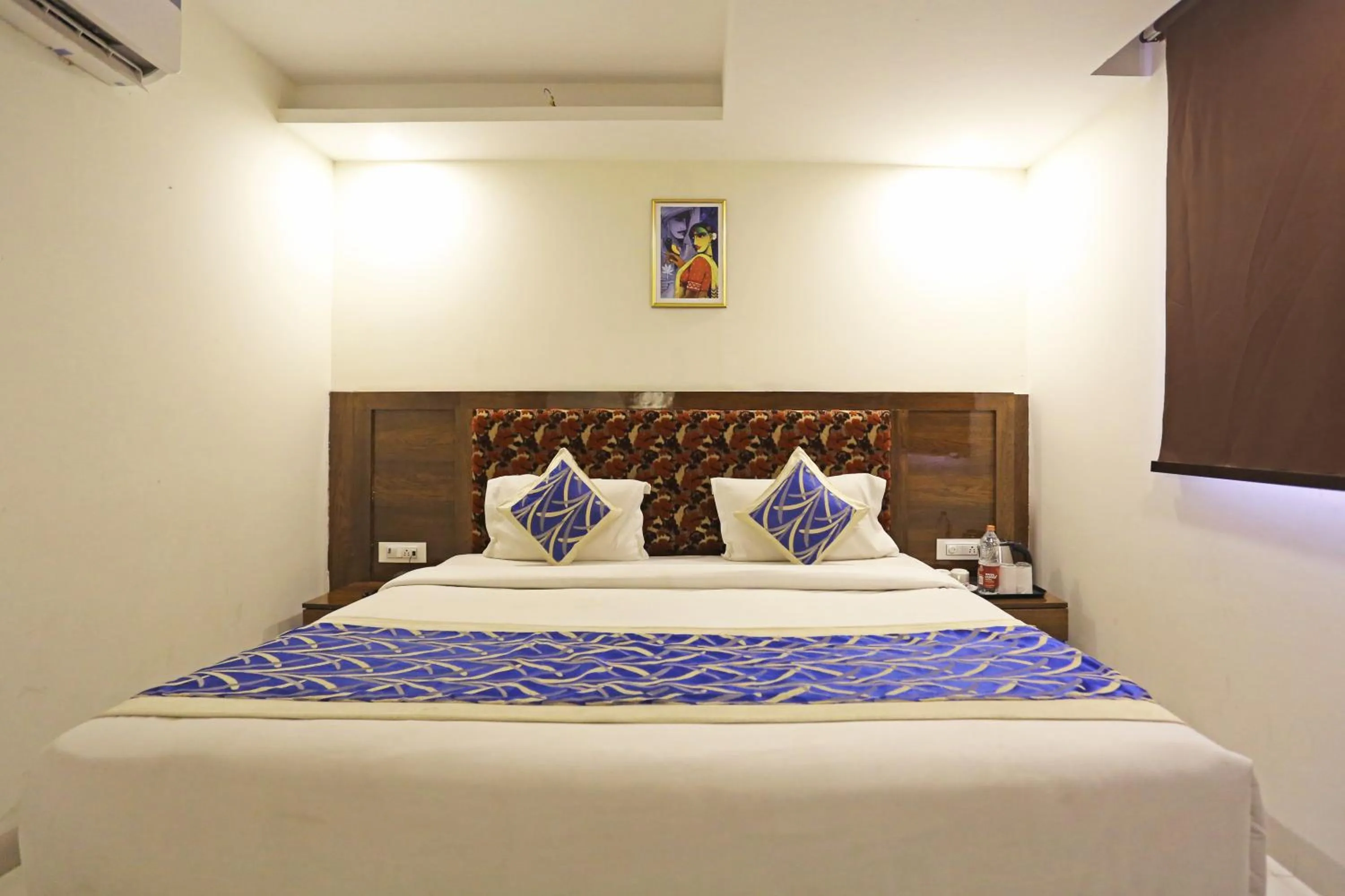 Bed in Hotel Emblem Suites- Near Delhi Airport