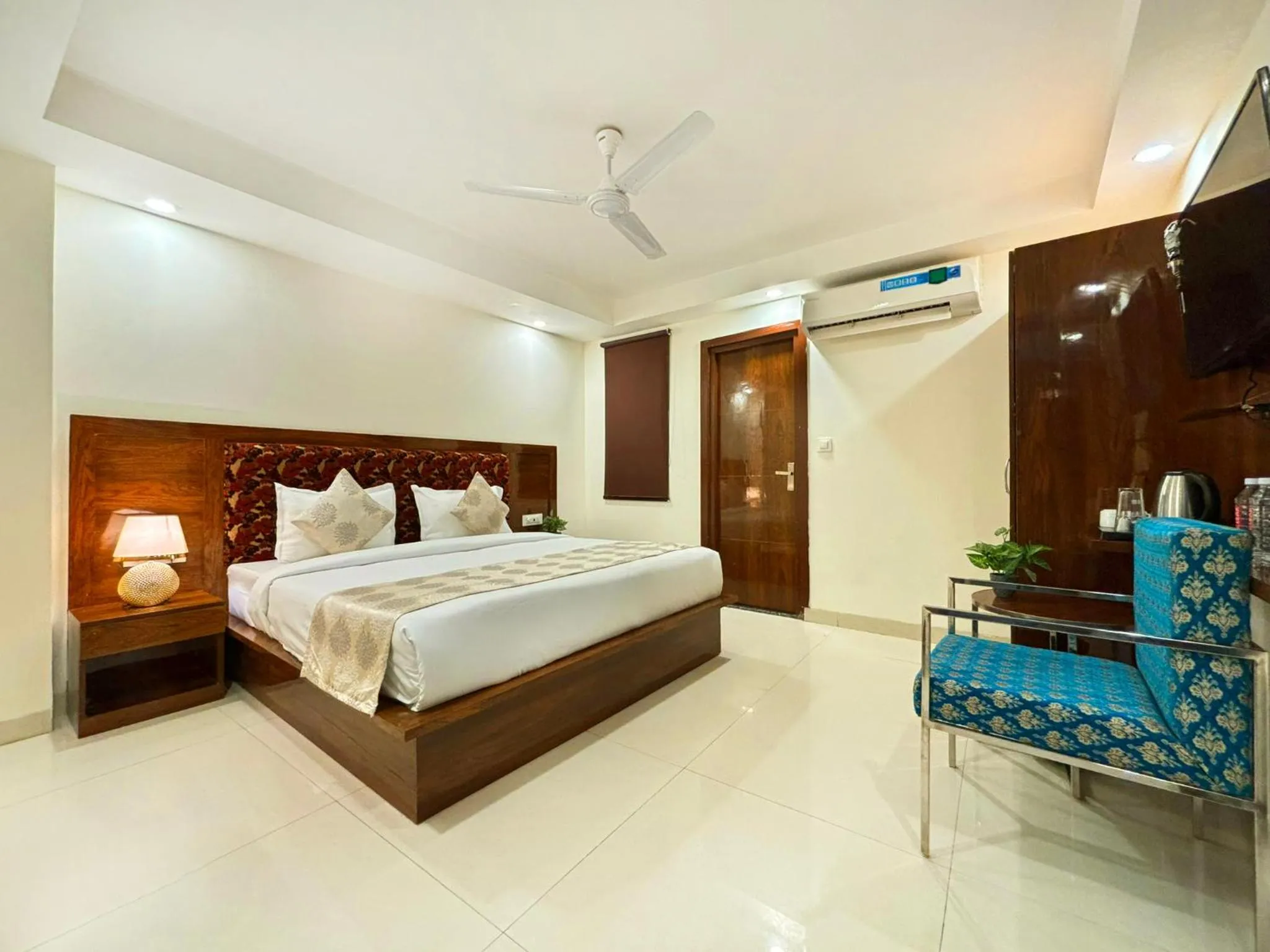 Photo of the whole room, Bed in Hotel Emblem Suites- Near Delhi Airport