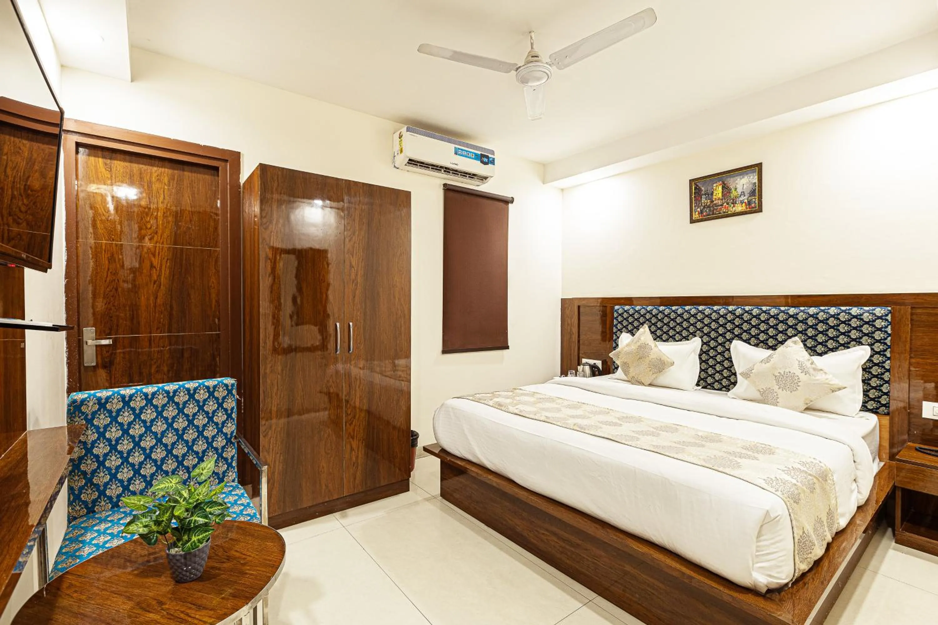Bed in Hotel Emblem Suites- Near Delhi Airport