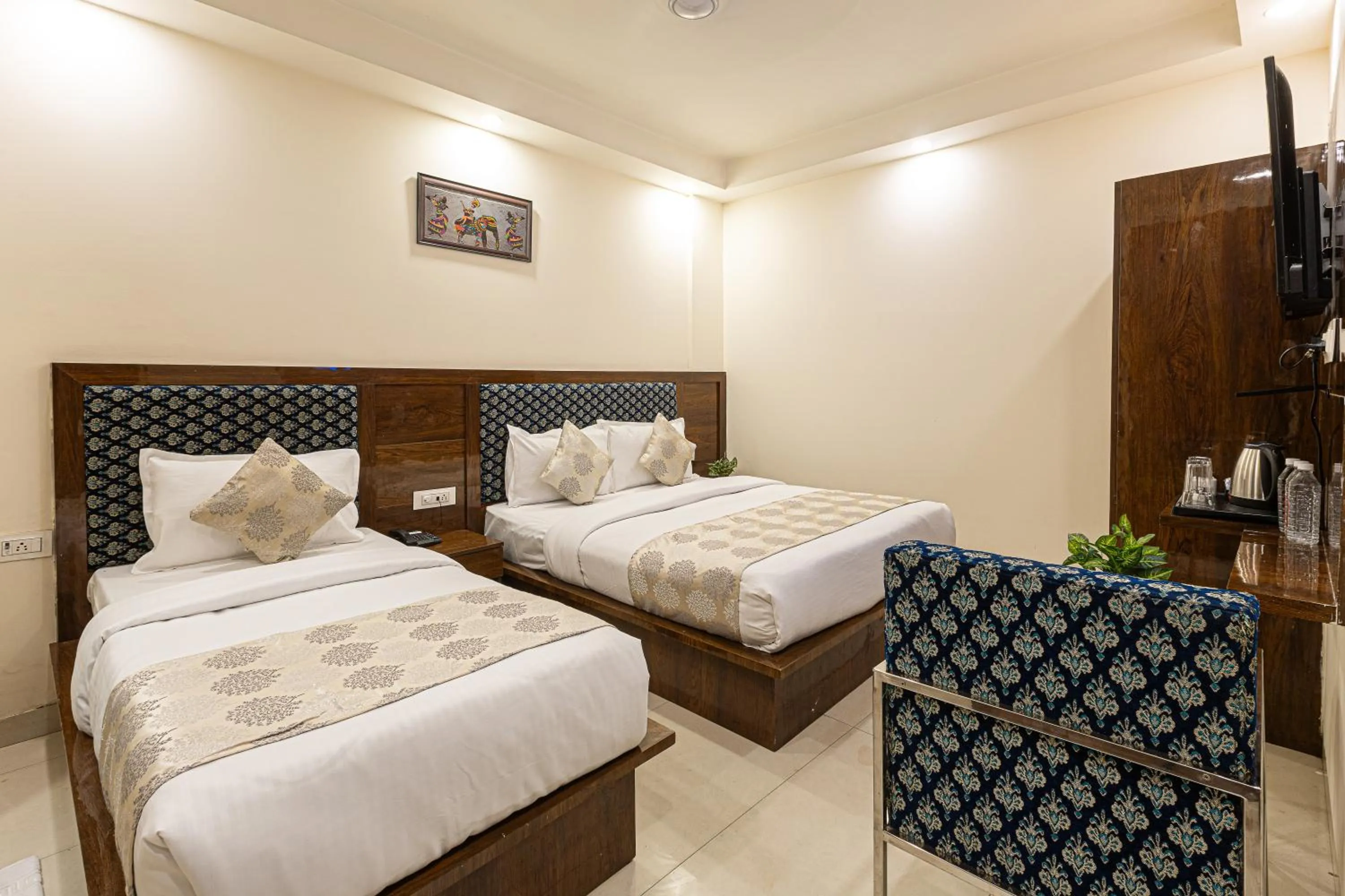 Bed in Hotel Emblem Suites- Near Delhi Airport