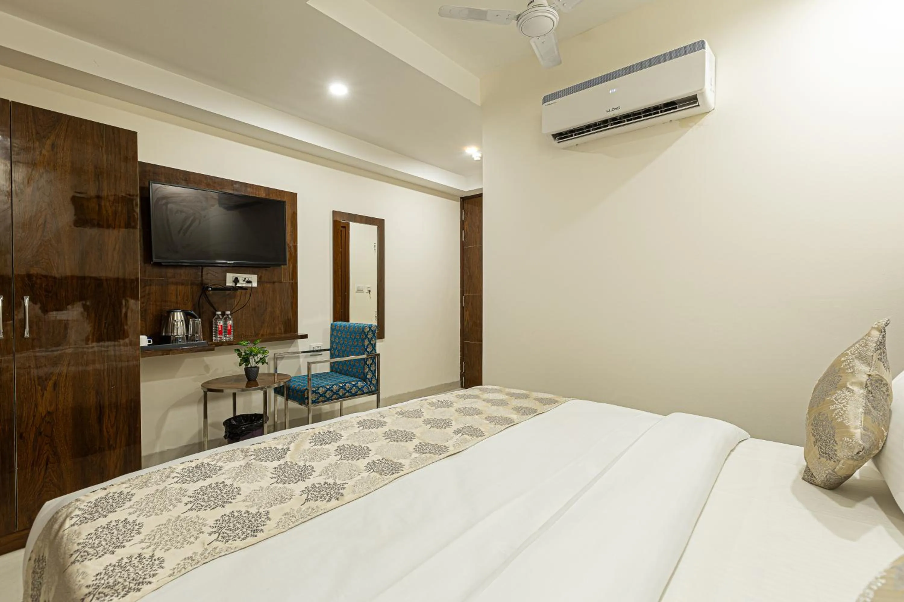 Bed in Hotel Emblem Suites- Near Delhi Airport