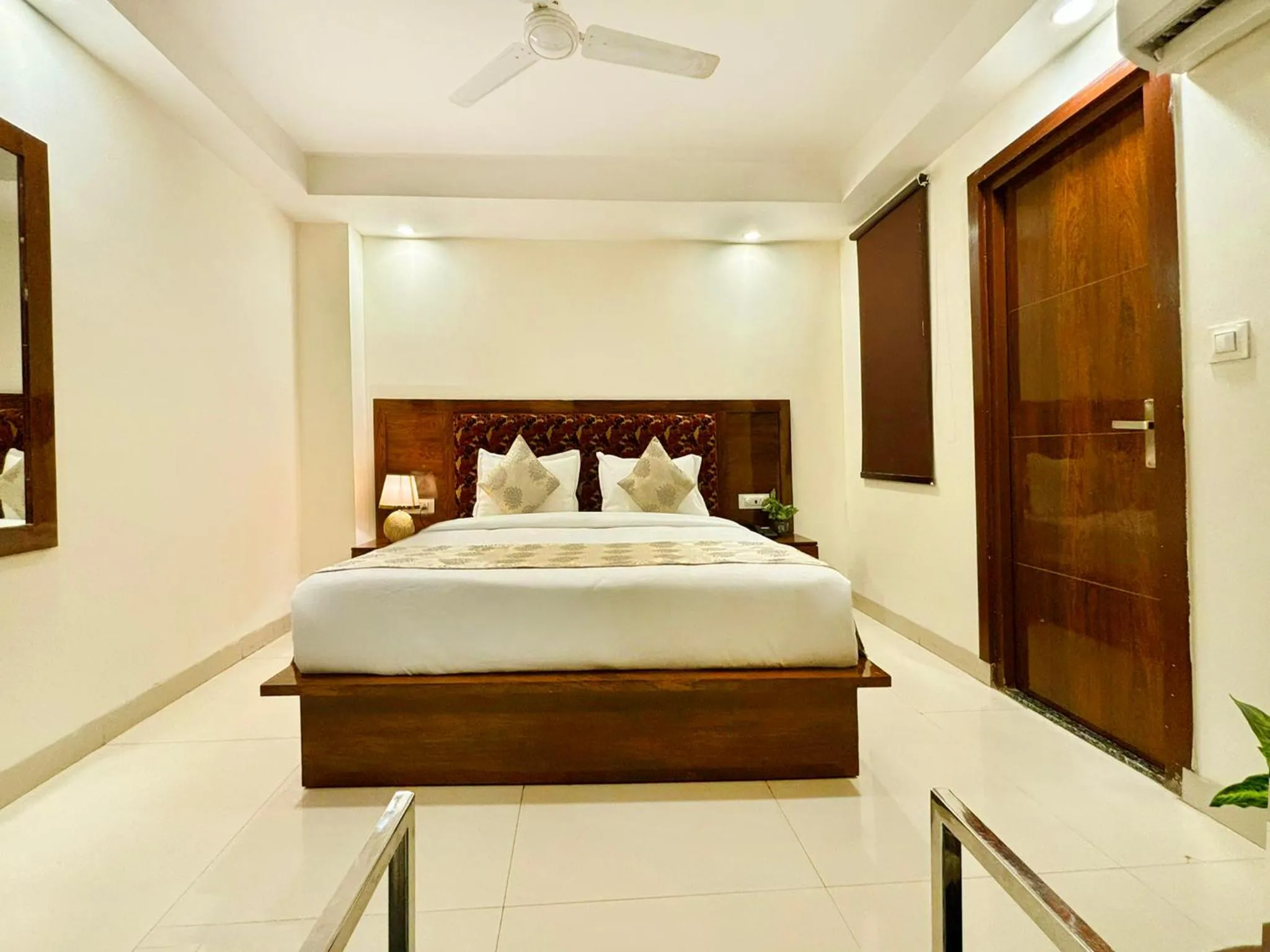 Bed in Hotel Emblem Suites- Near Delhi Airport