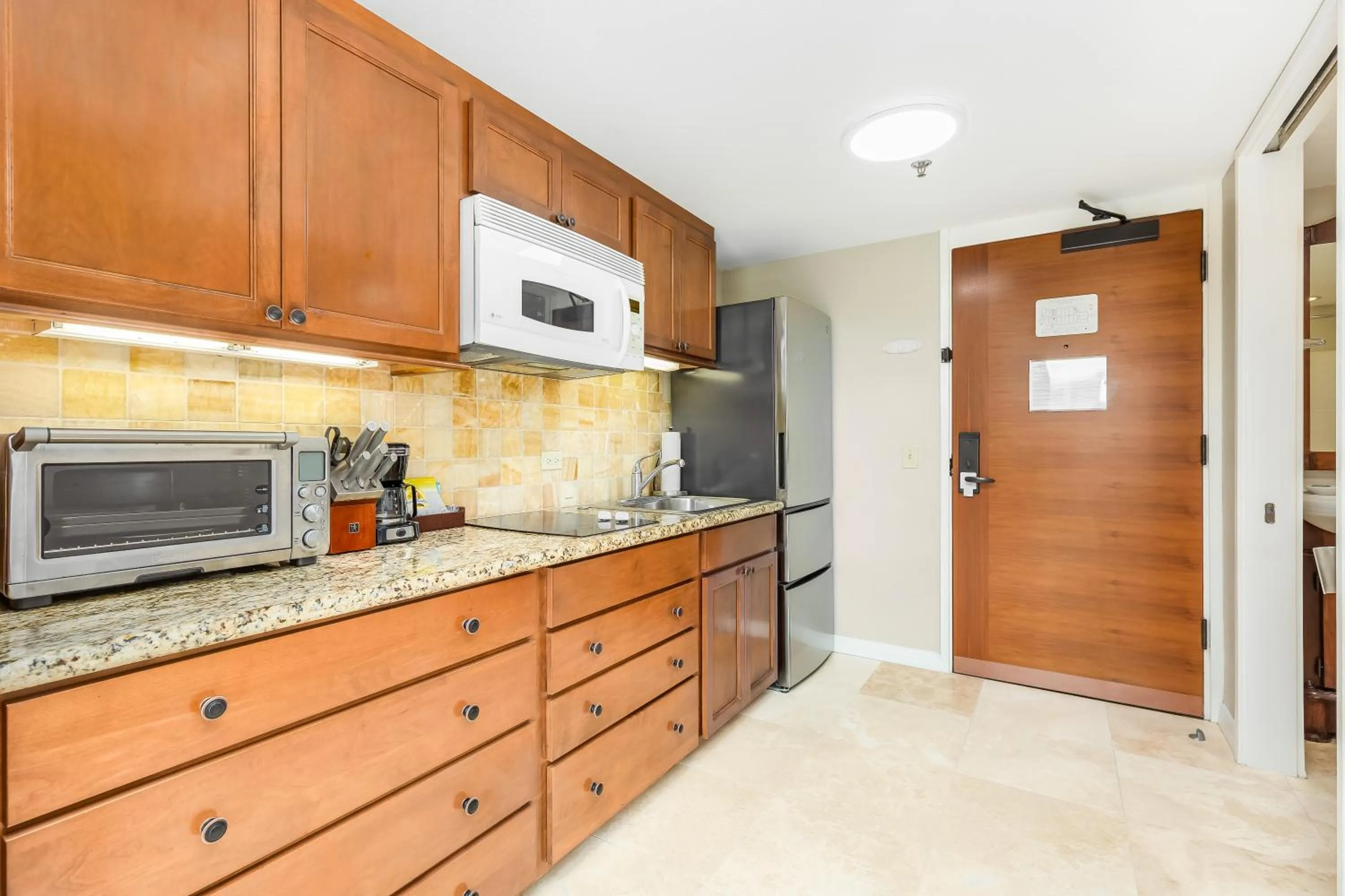 Kitchen or kitchenette in Luana Waikiki Hotel & Suites