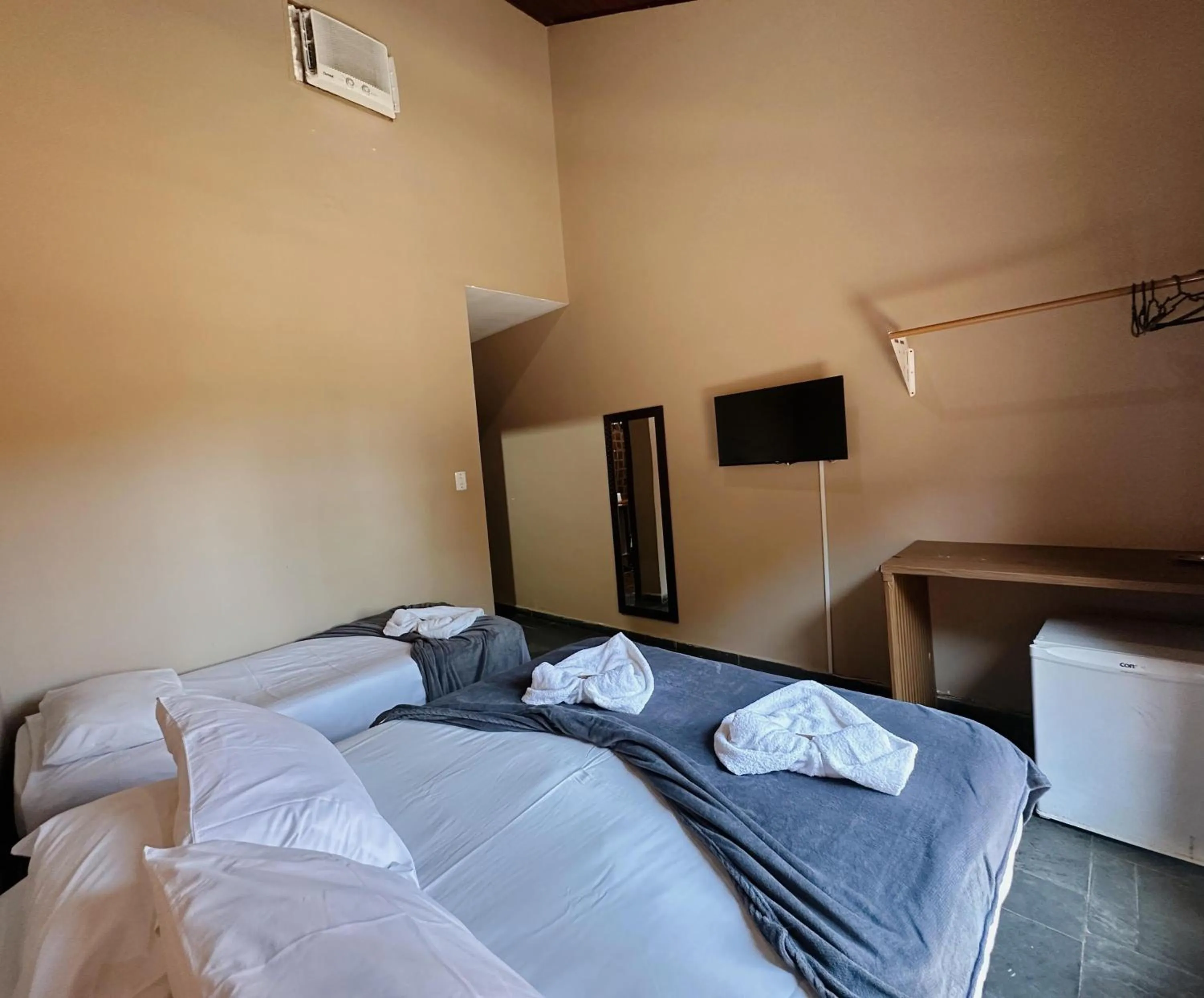 Bed in Pousada Ponta dos Corais