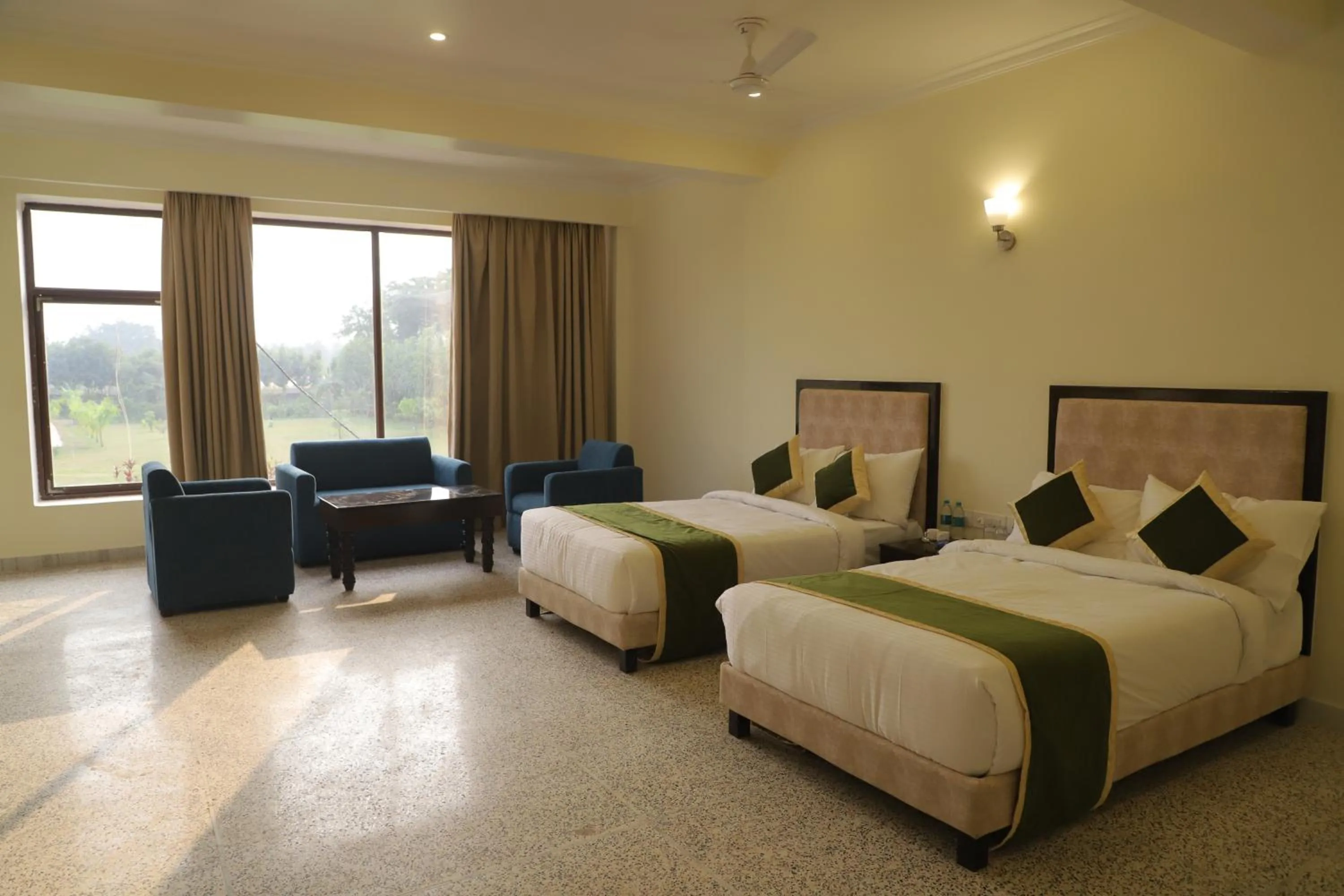 Bed in Gautam Hotels & Resorts