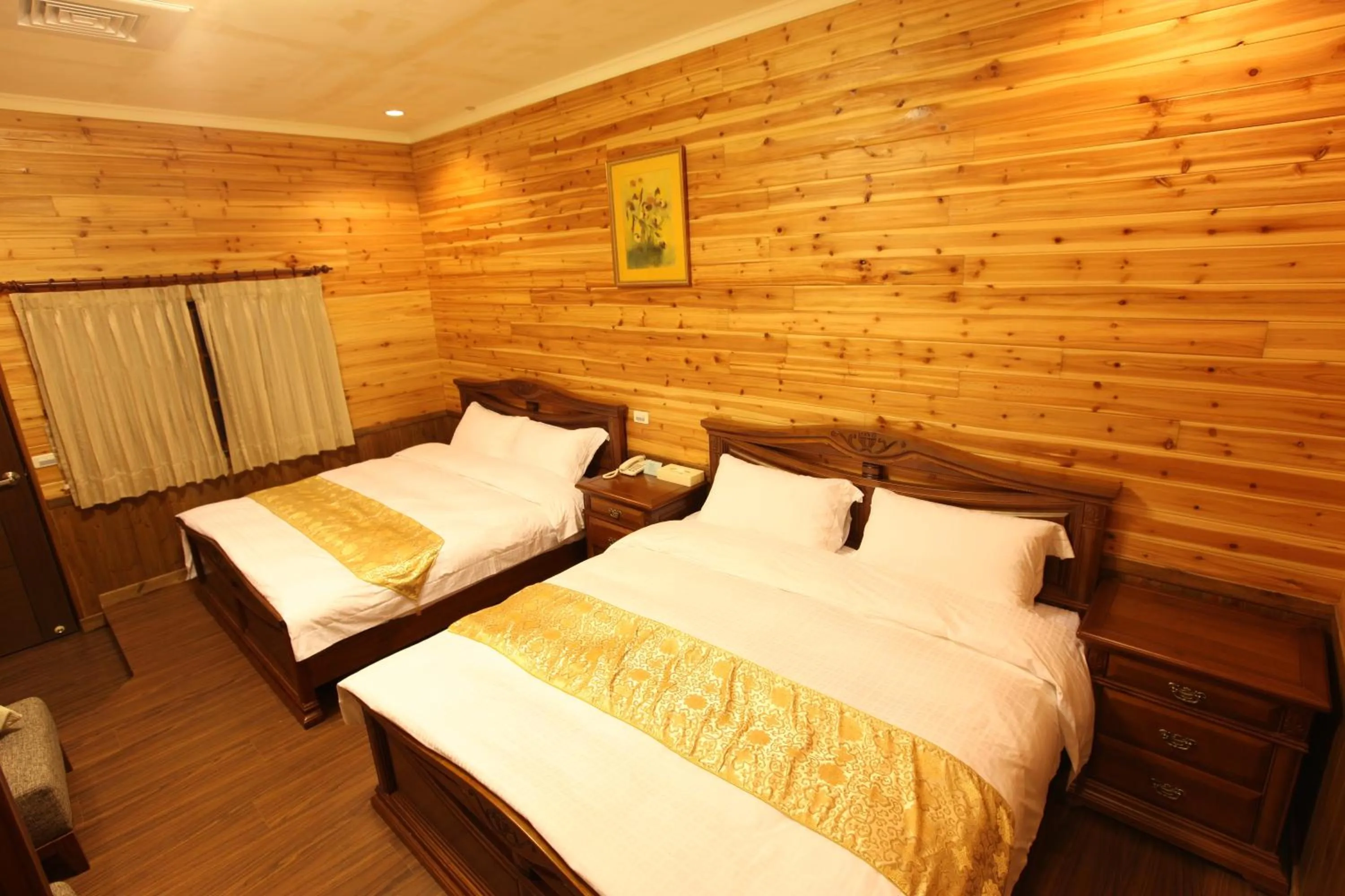 Bed in Zen and Pine Resort