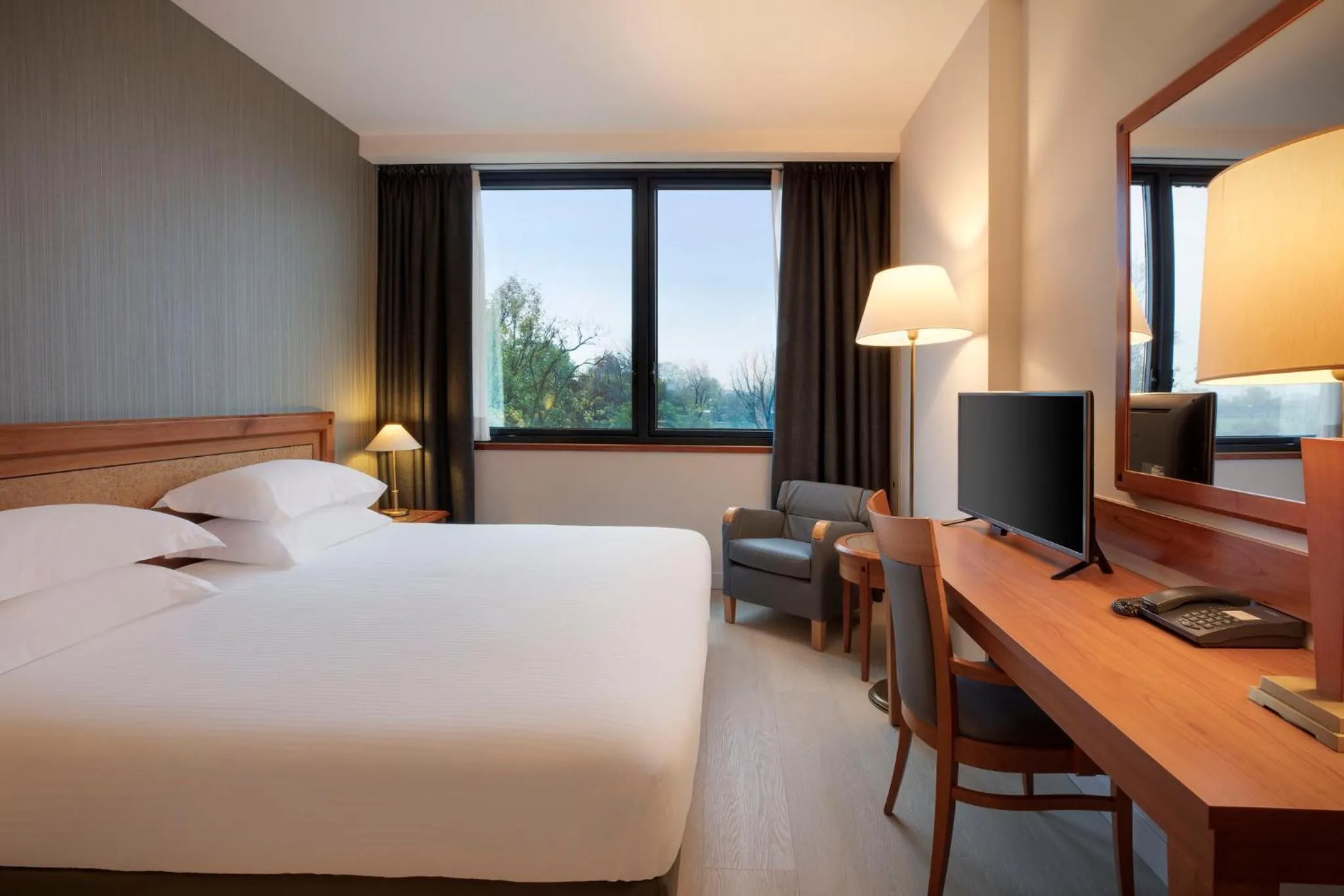 Photo of the whole room, Bed in Crowne Plaza Milan Linate by IHG