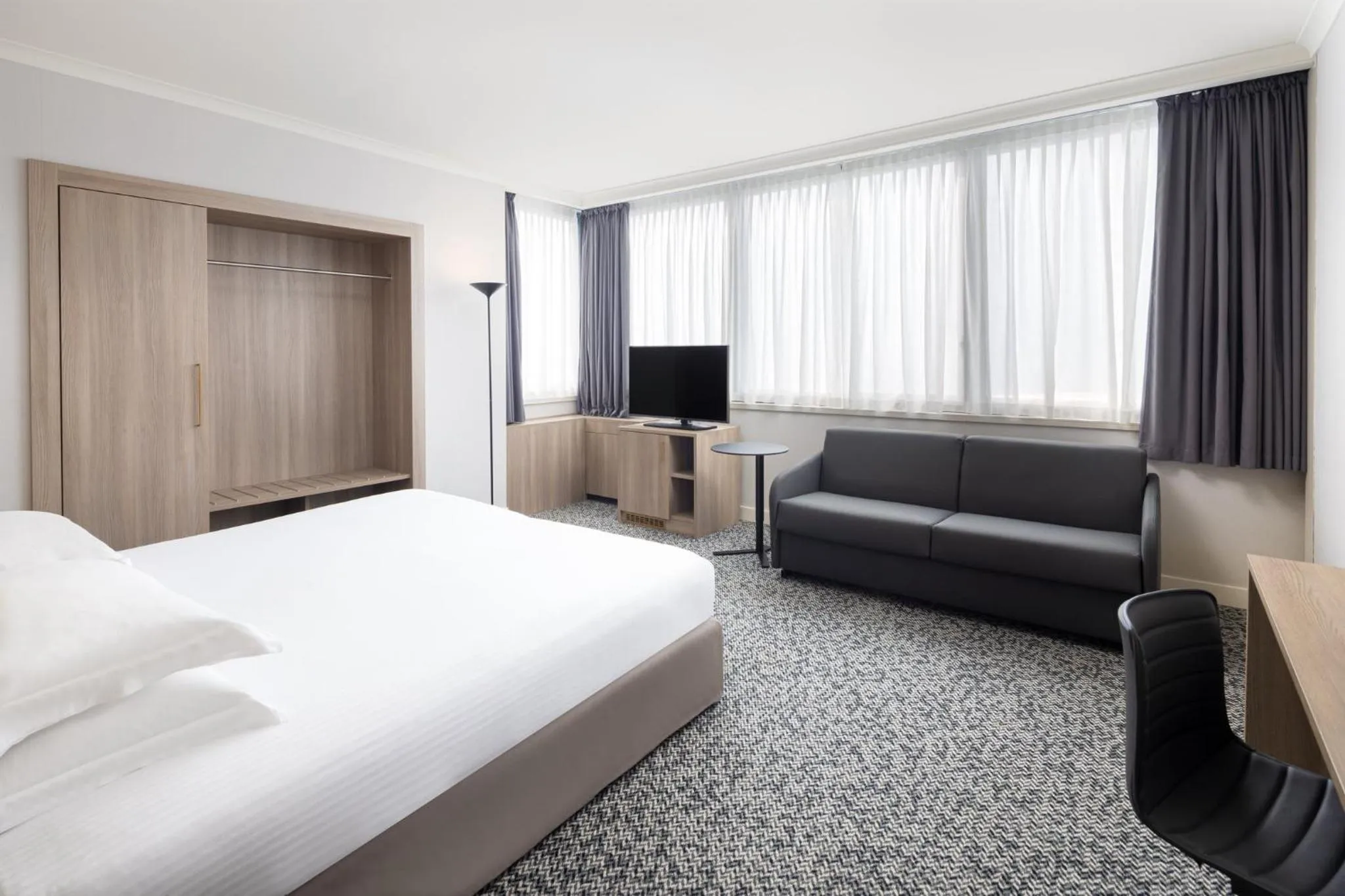 Photo of the whole room, Bed in Crowne Plaza Milan Linate by IHG