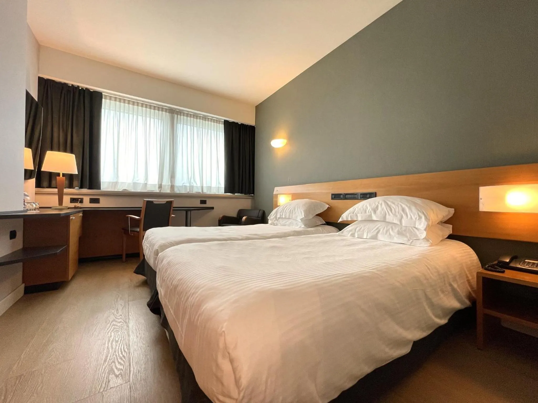 Photo of the whole room, Bed in Crowne Plaza Milan Linate by IHG
