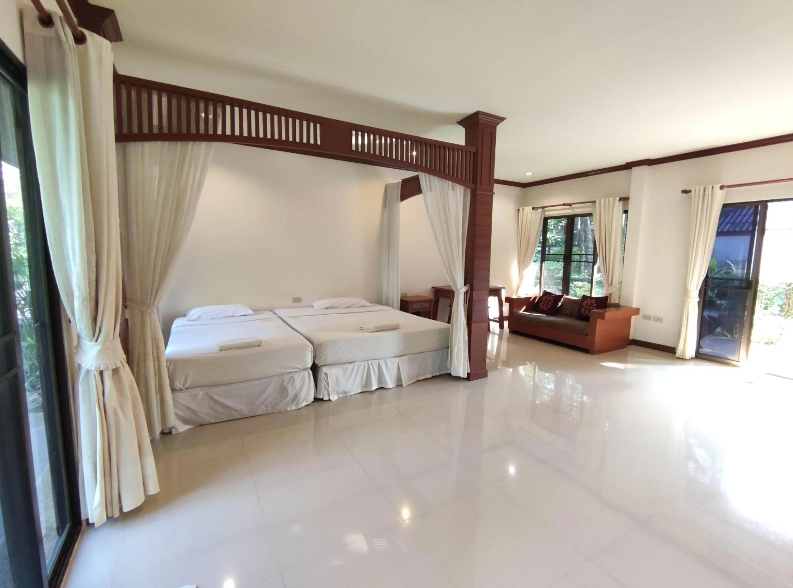 Bed in Thara Cholapruek Resort