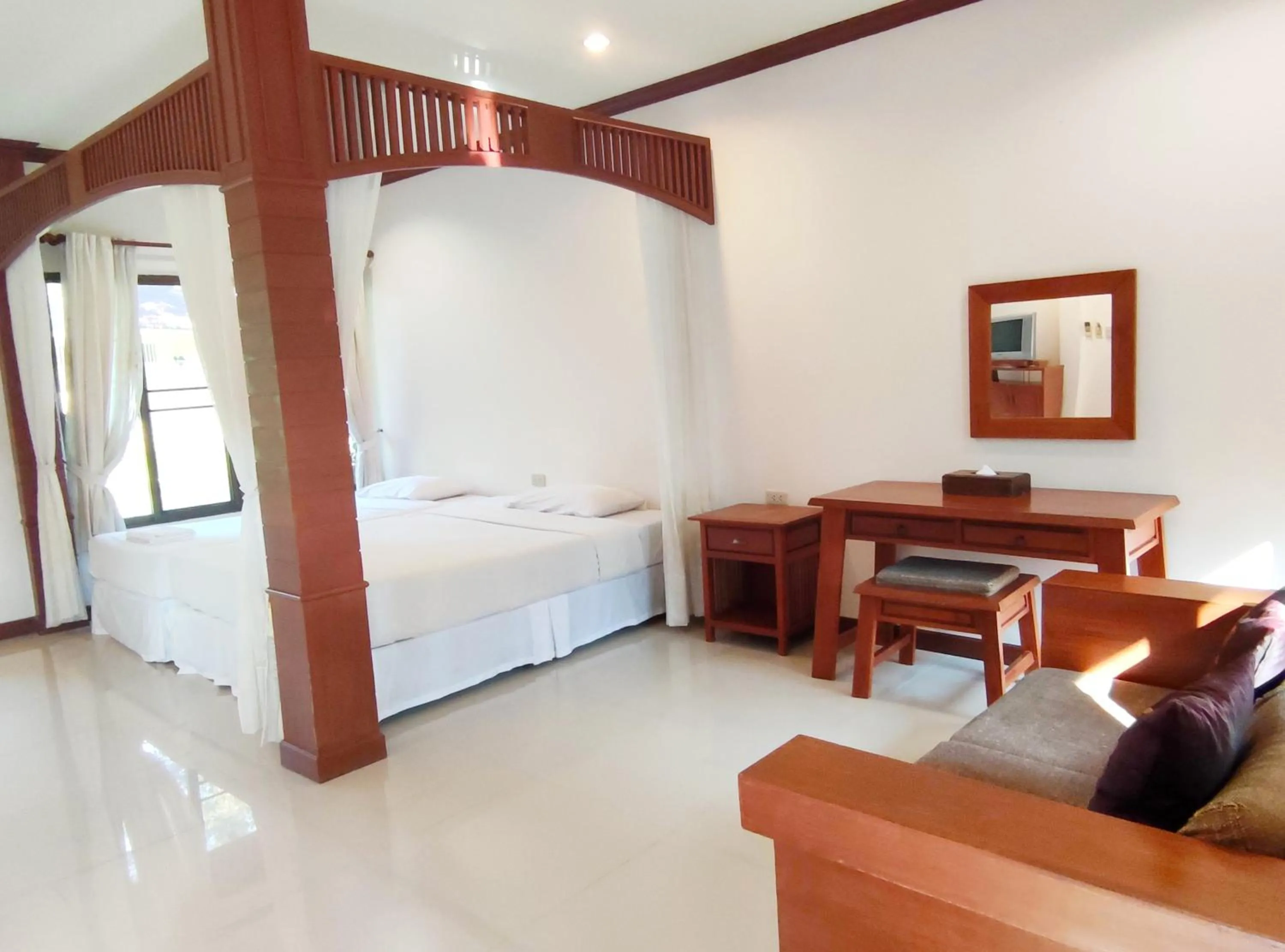 Bed in Thara Cholapruek Resort