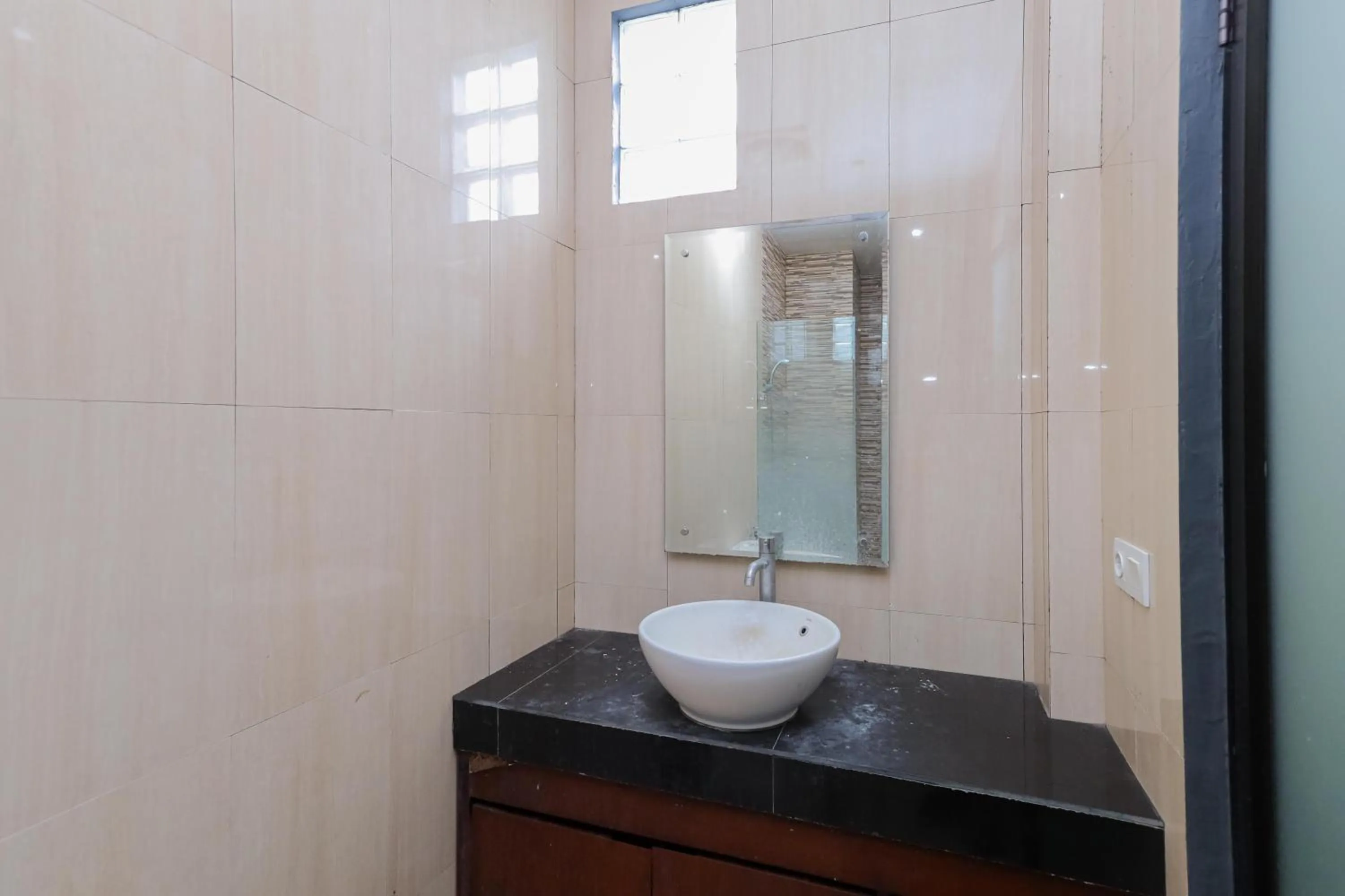 Bathroom in Urbanview Hotel WG Jimbaran Bali