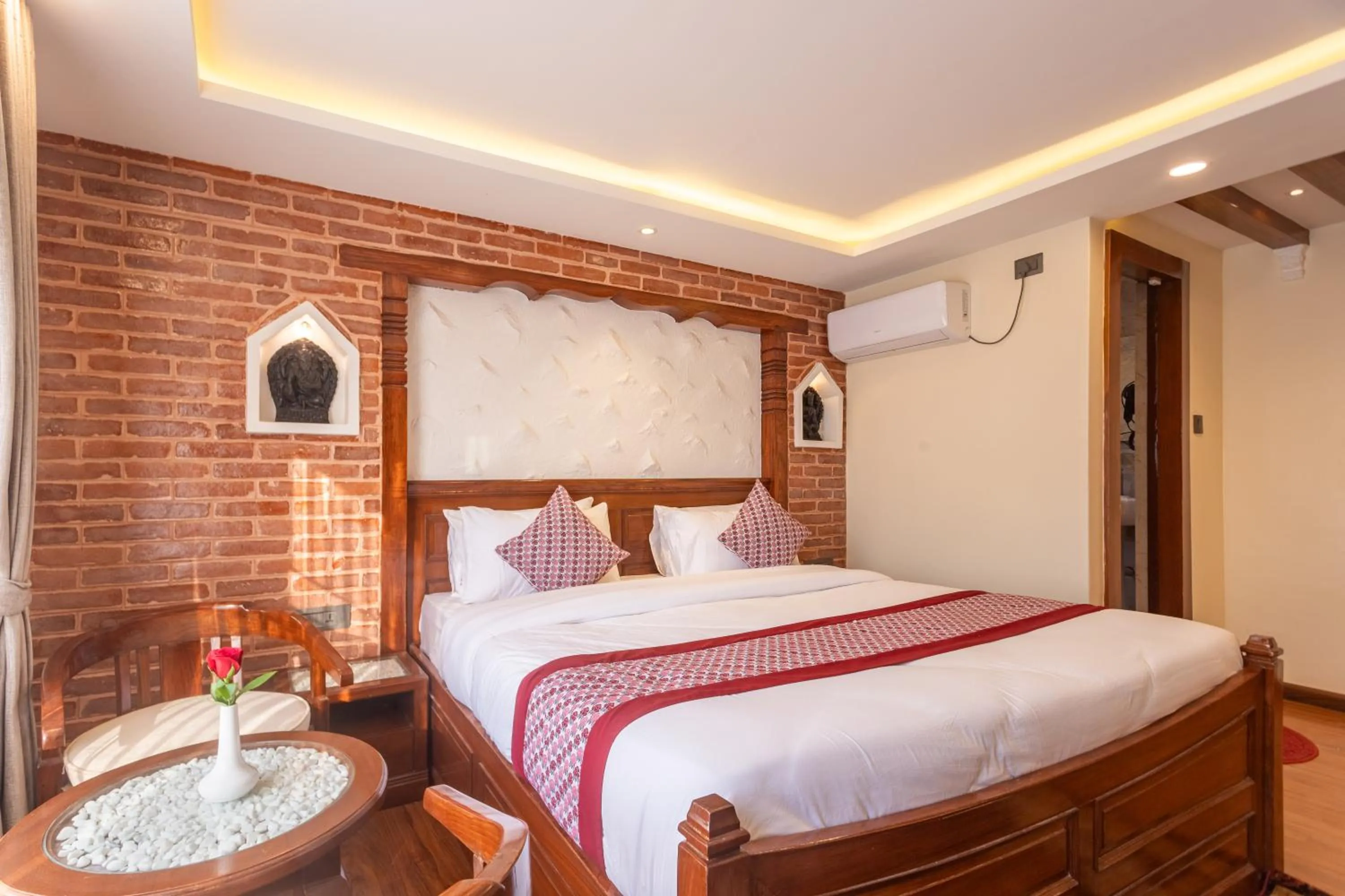 Bed in Amarawati Boutique Hotel