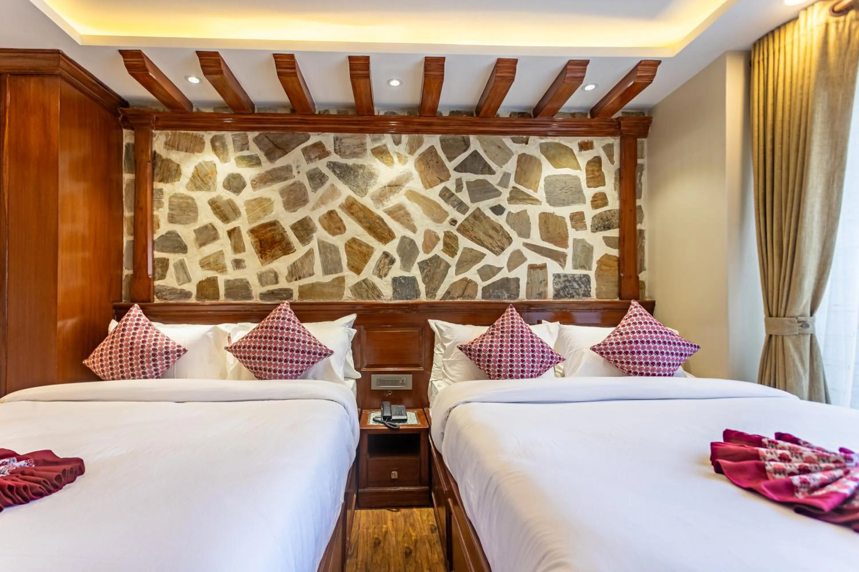 Bed in Amarawati Boutique Hotel