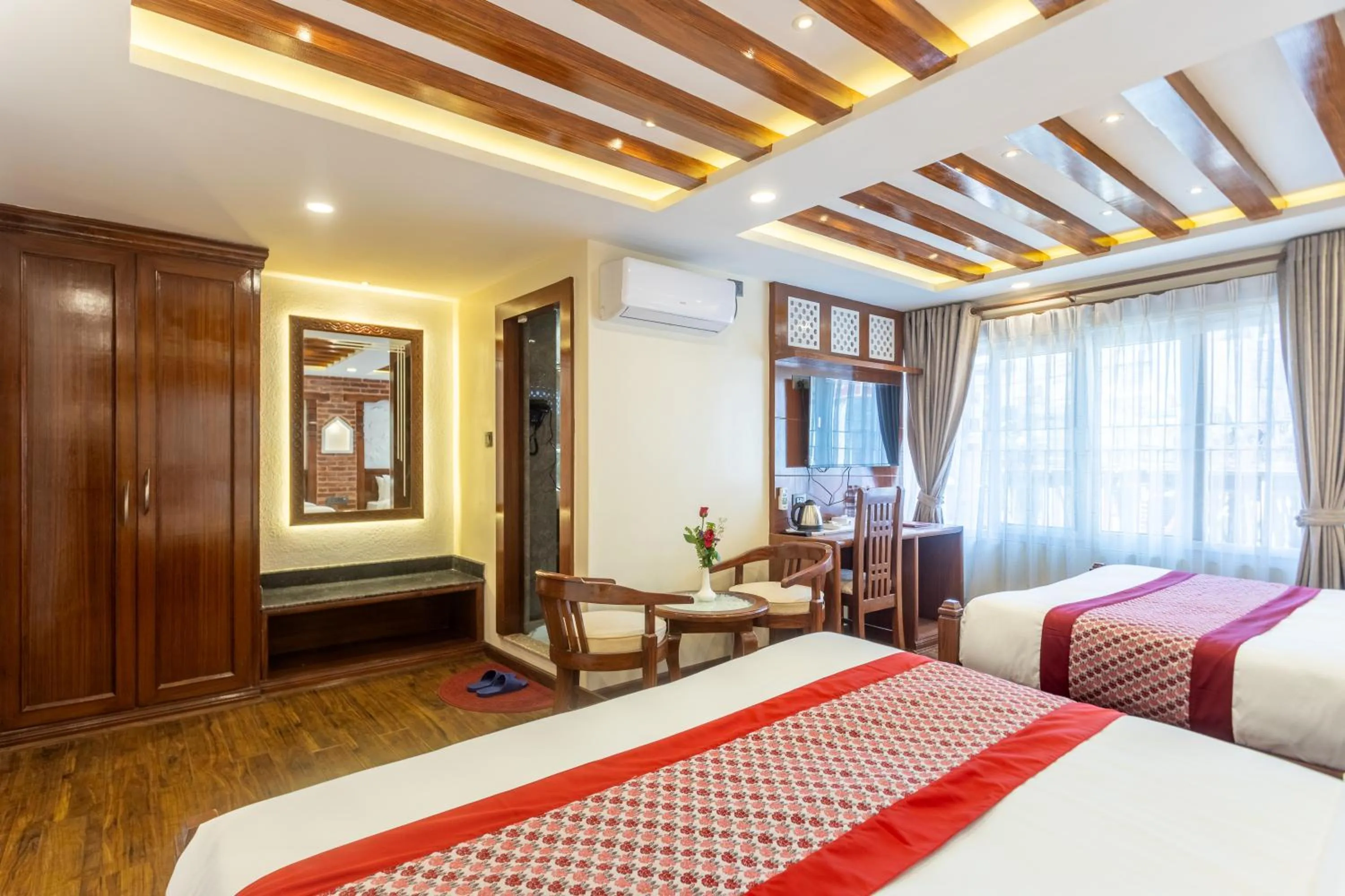 Bed in Amarawati Boutique Hotel