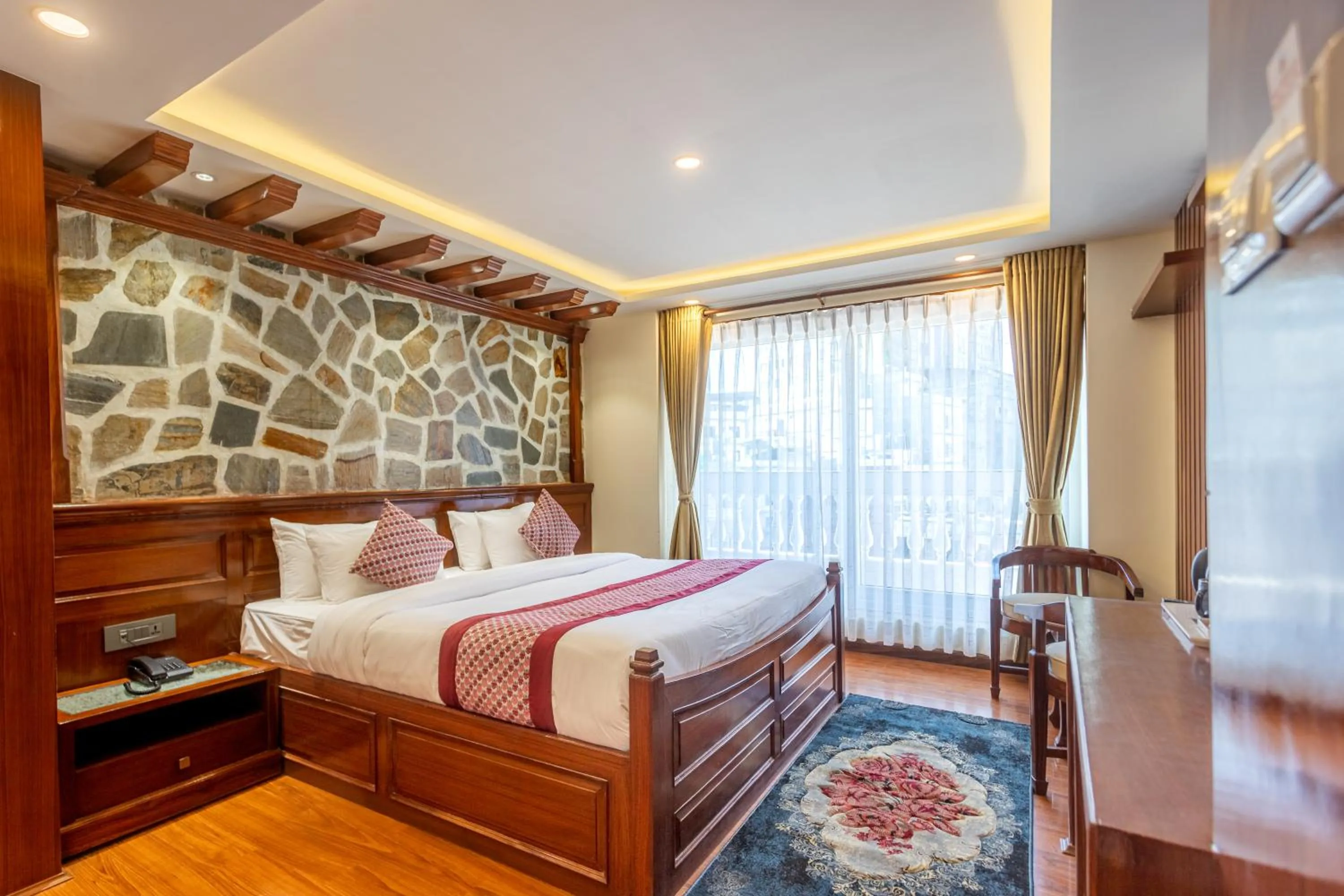 Seating area, Bed in Amarawati Boutique Hotel