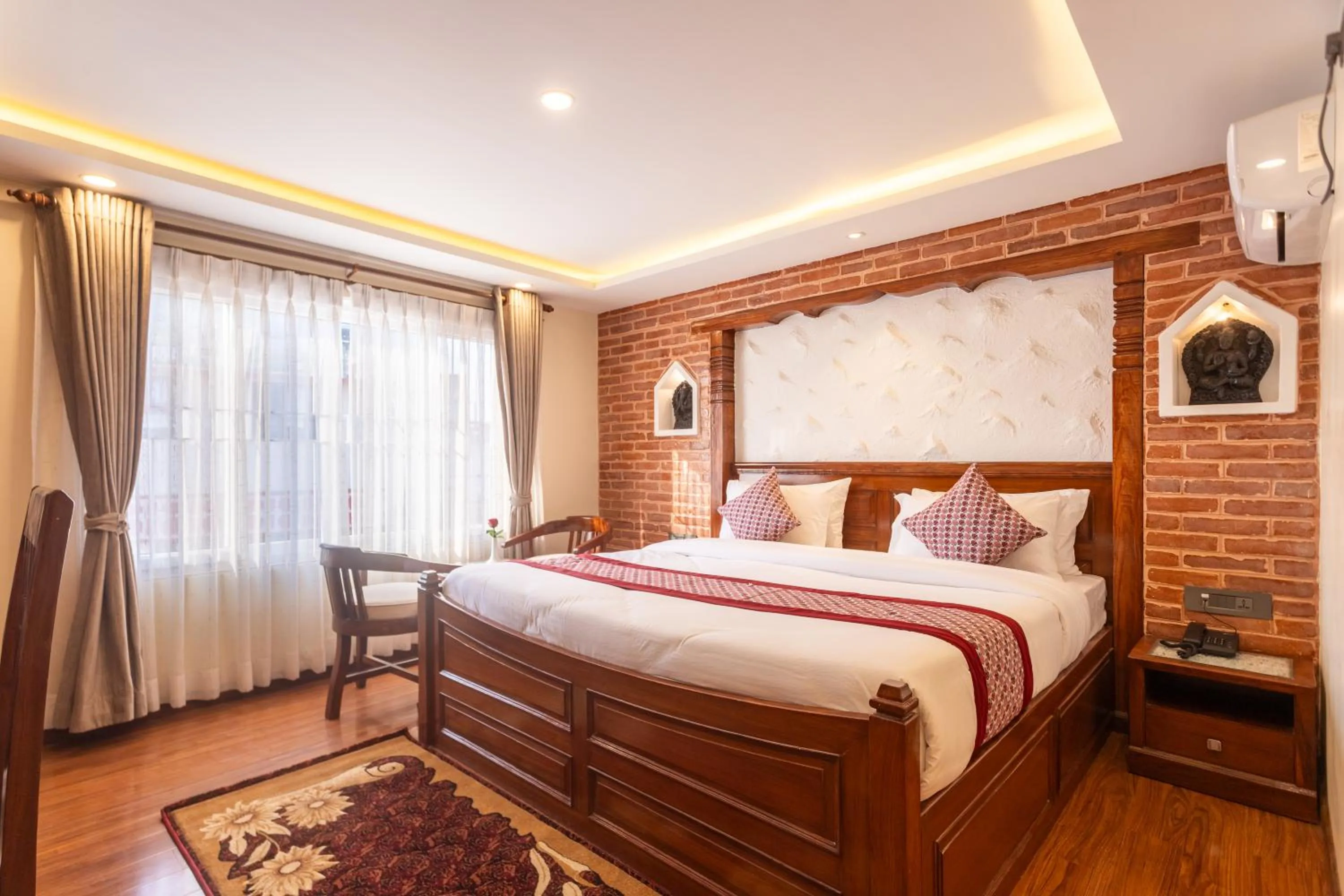 Bed in Amarawati Boutique Hotel