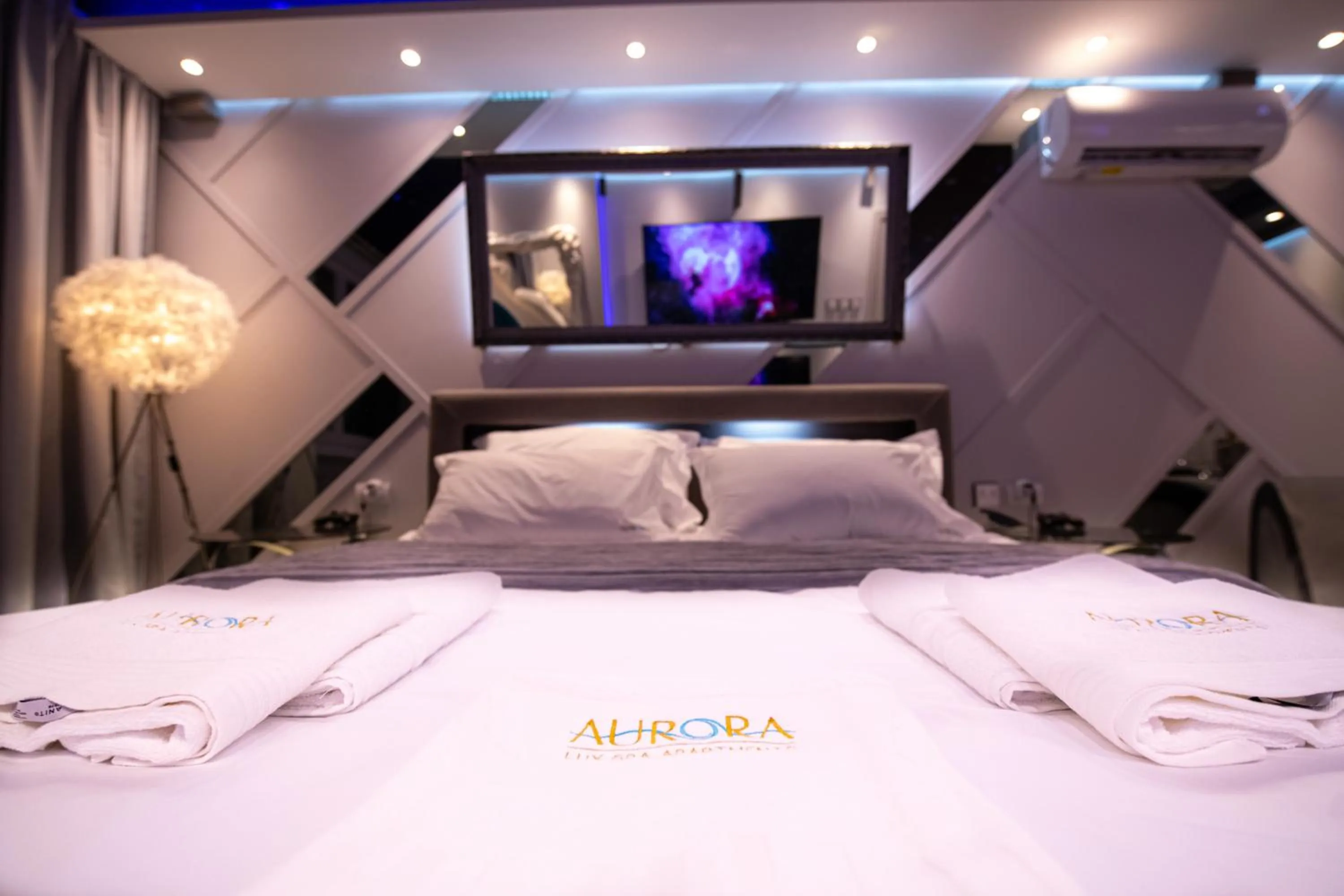 Bed in Aurora Lux Spa Smart apartments