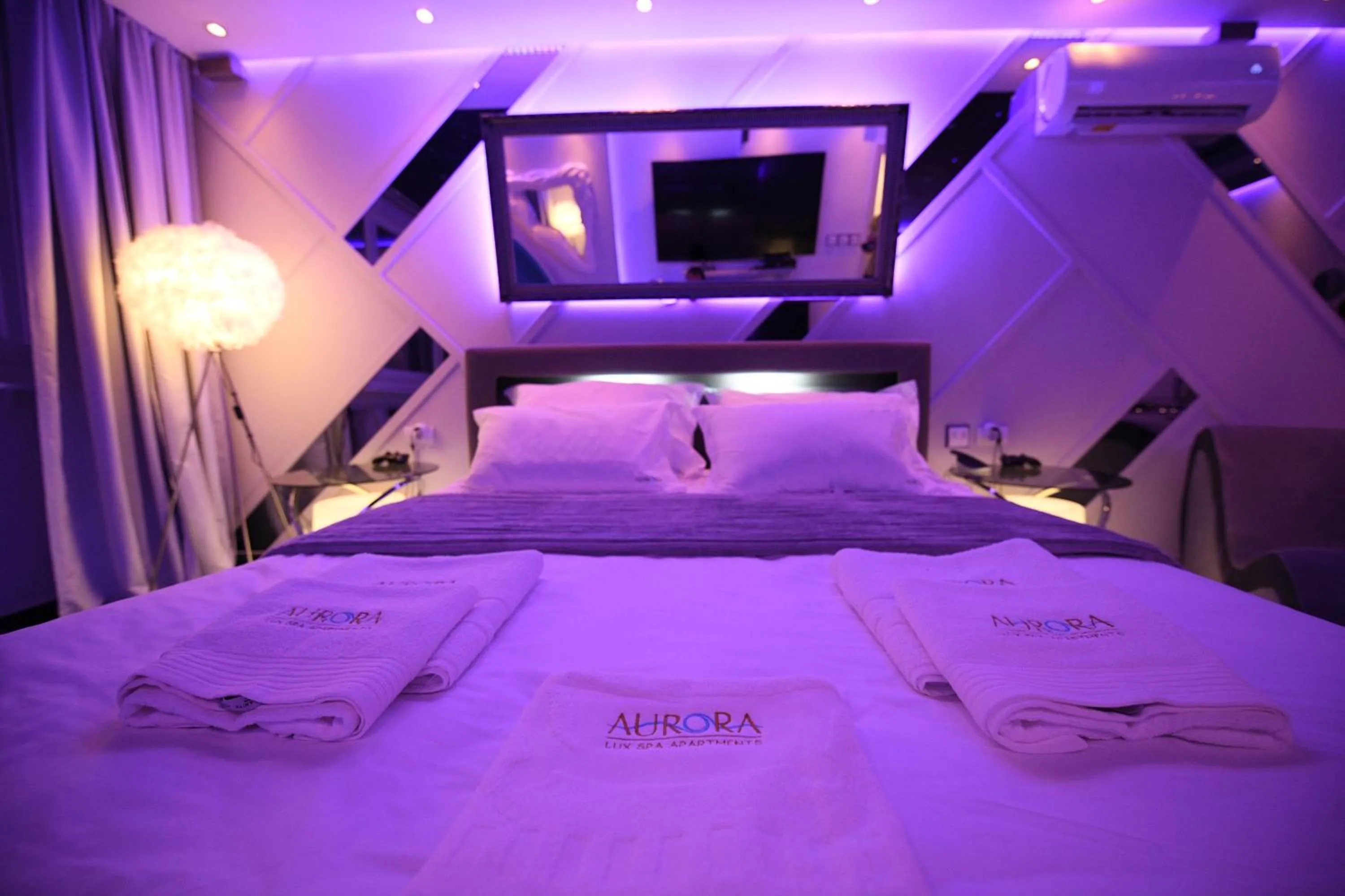 Bed in Aurora Lux Spa Smart apartments