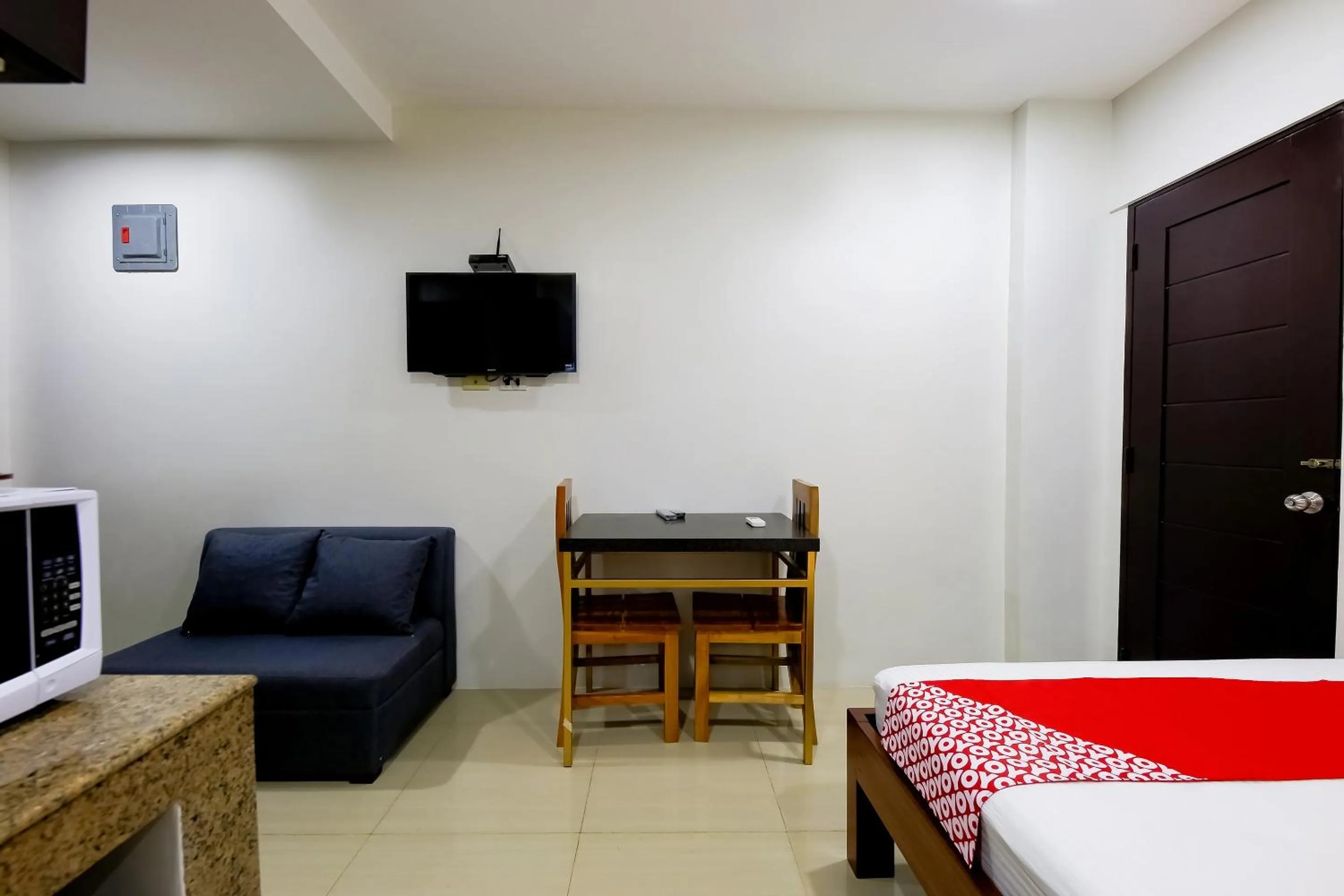 Bedroom in OYO 848 Dona Aurora Condotel